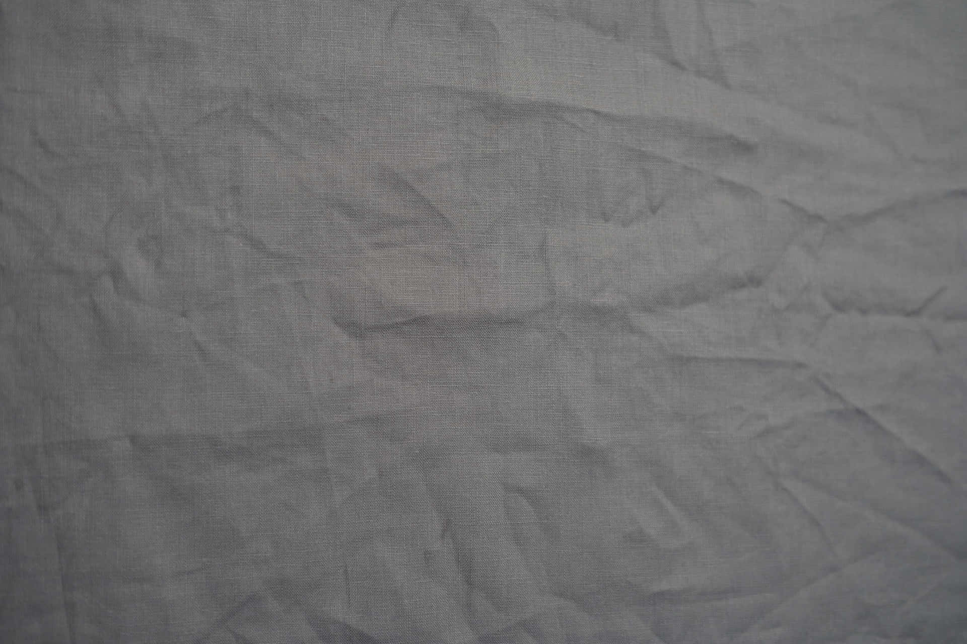 A Close Up Of A Grey Fabric