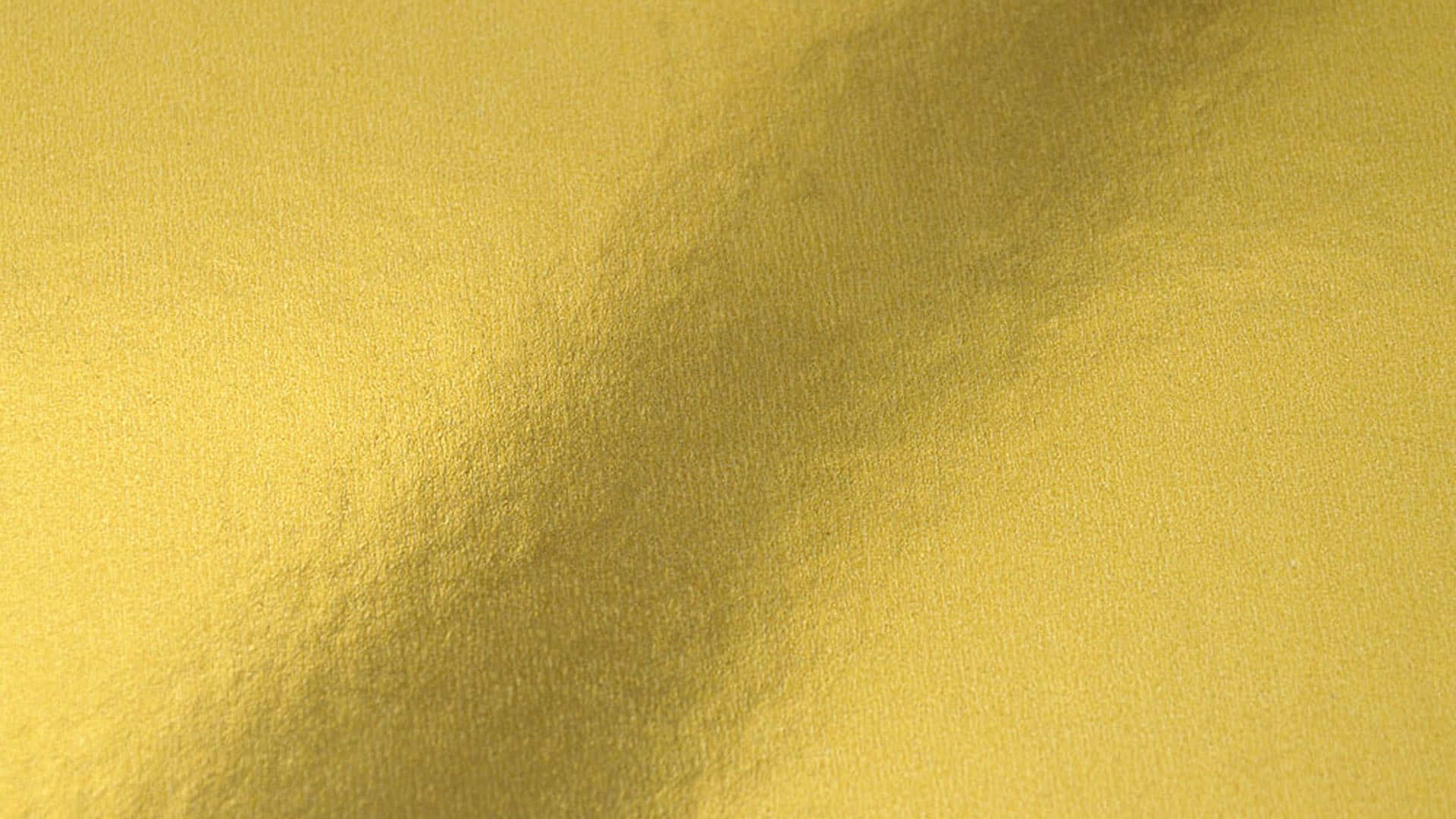 A Close Up Of A Metallic Gold Surface Background