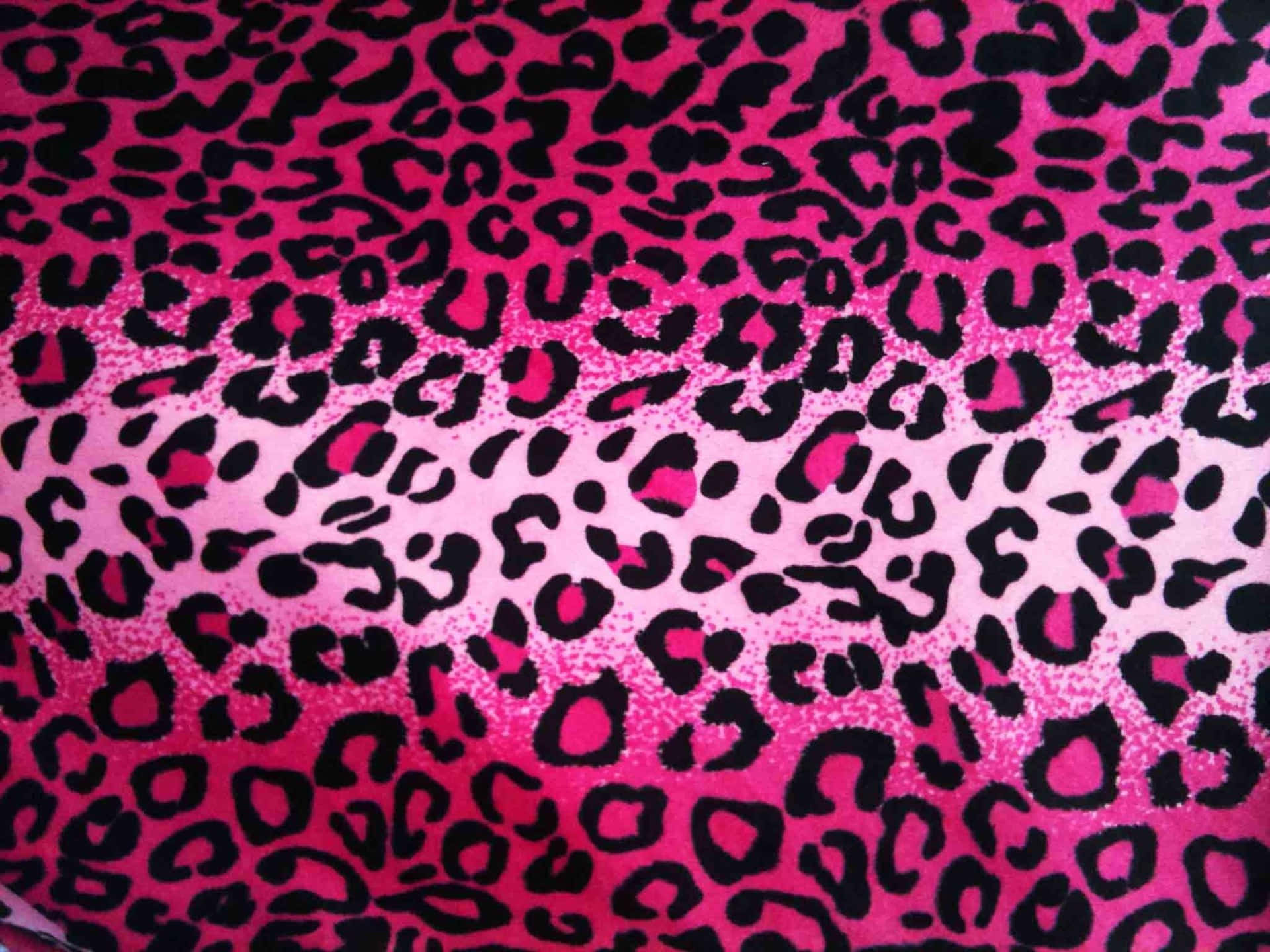 A Close Up Of A Pink Leopard Print Fabric Background