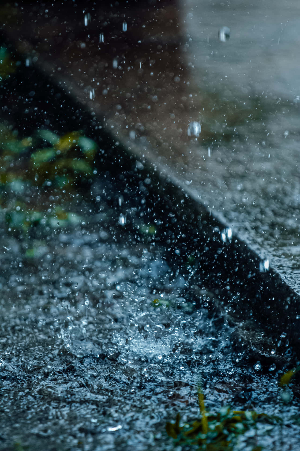 A Close Up Of A Rain Drop On A Sidewalk Background