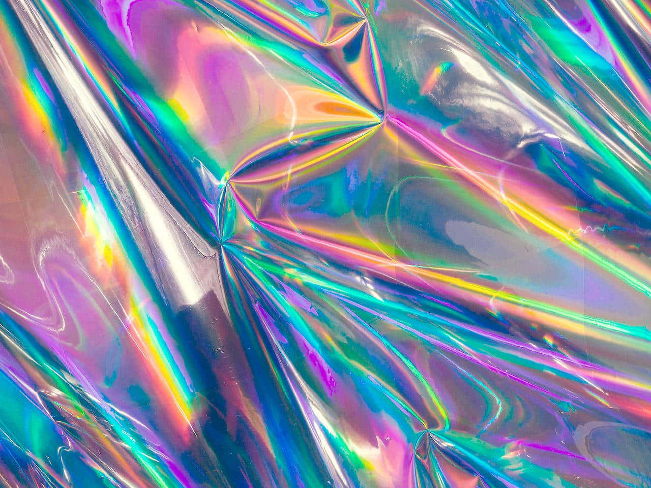 A Close Up Of A Shiny Holographic Fabric Background