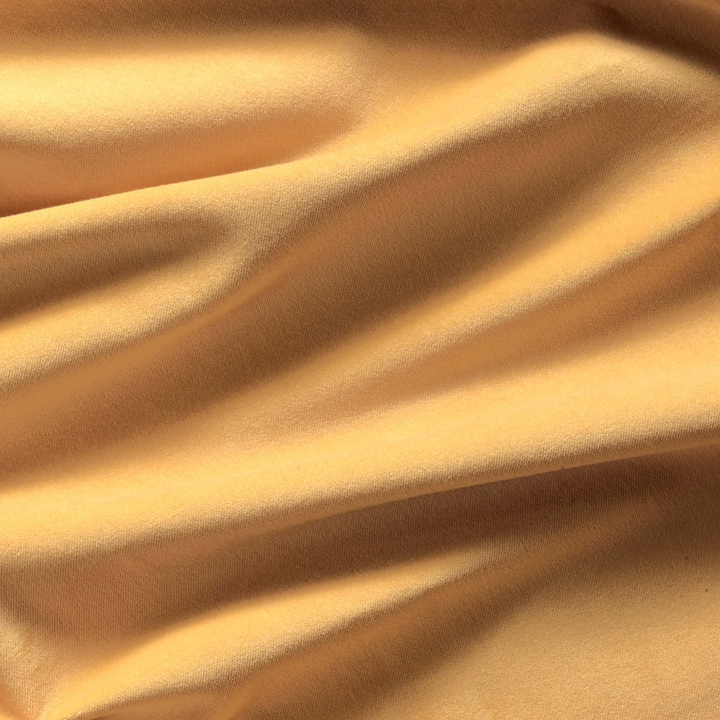 A Close Up Of A Yellow Fabric Background