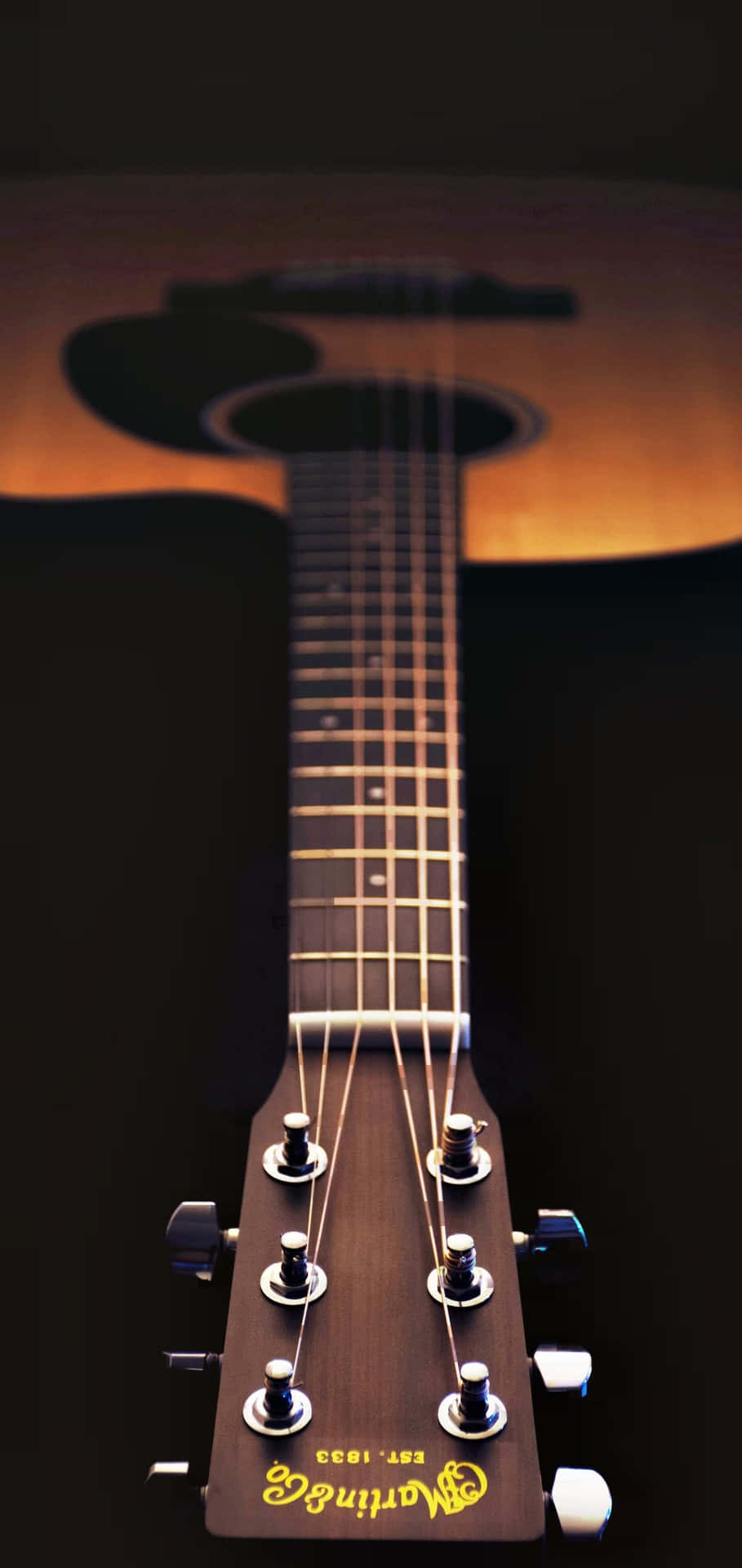 A Close Up Of An Acoustic Guitar