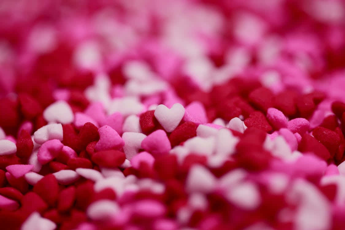 A Close Up Of Pink And White Hearts