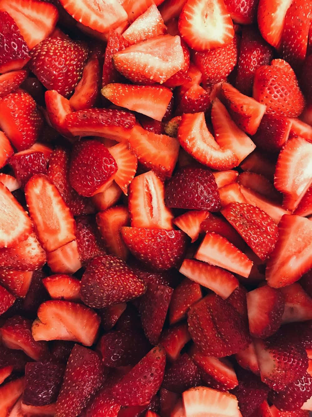 A Close Up Of Strawberries In A Bowl Background