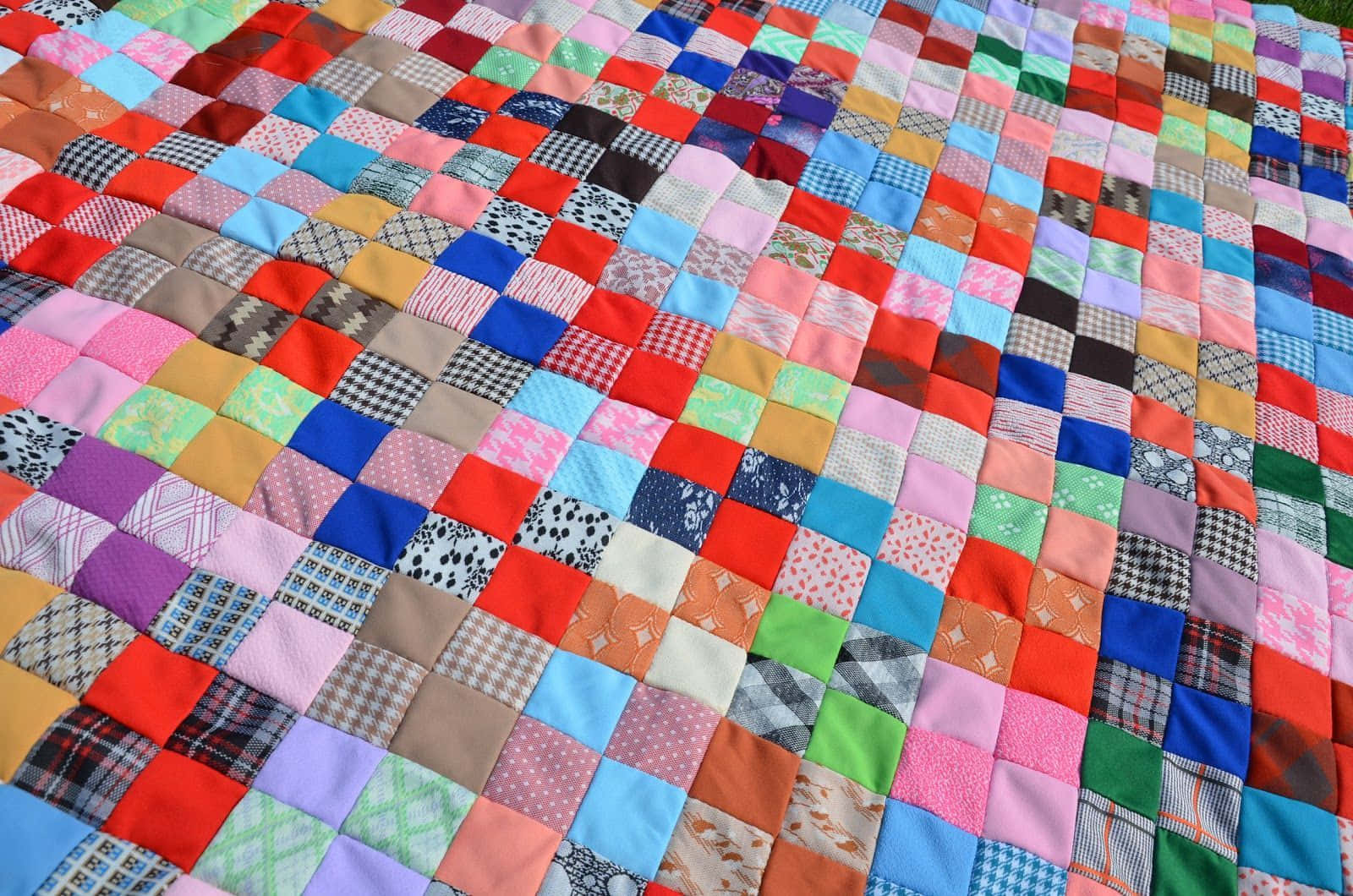 A Close-up Of Traditional Patchwork Quilt Stitching Background