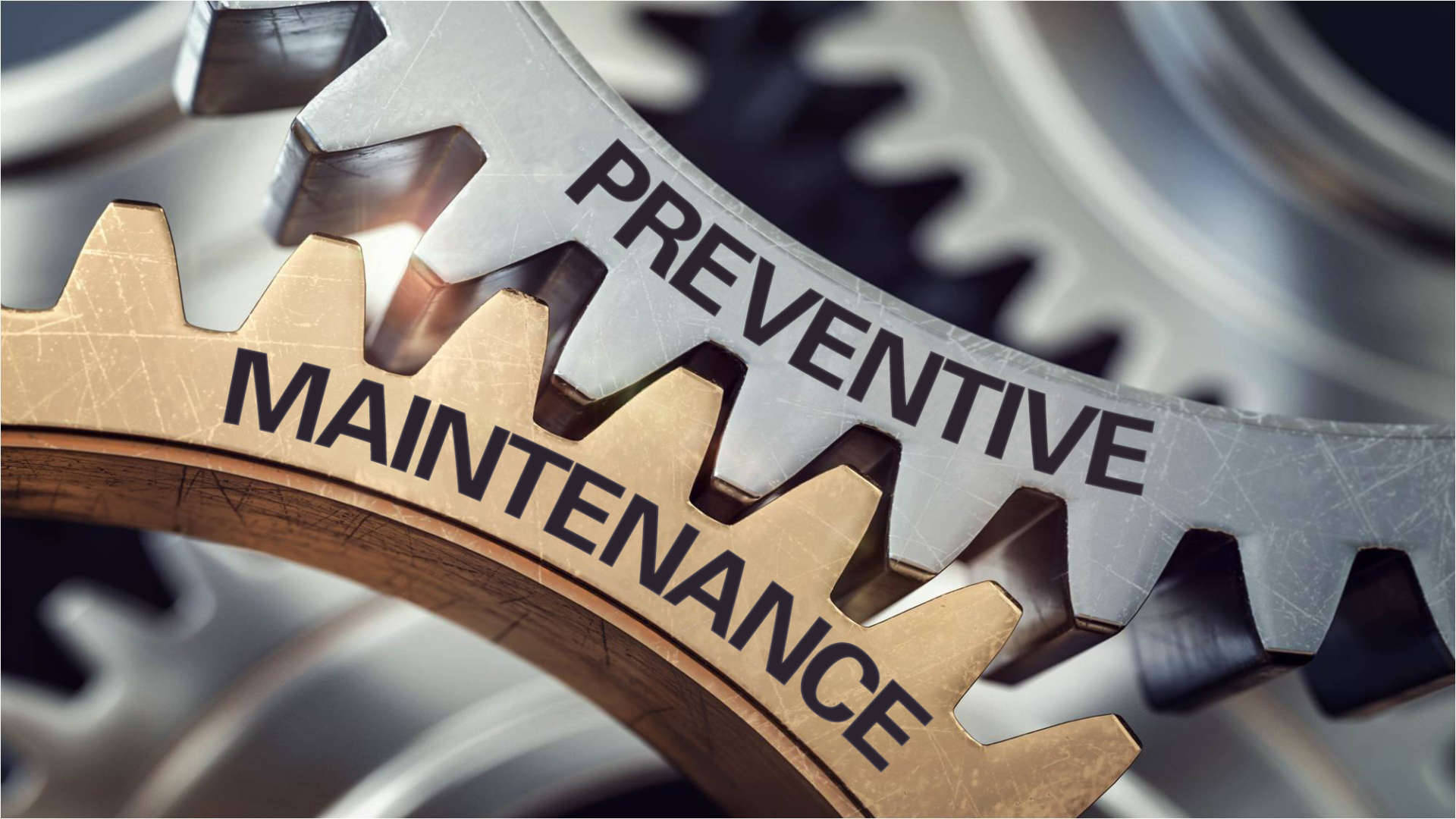 A Close-up Of Working Gears Signifying Preventive Maintenance