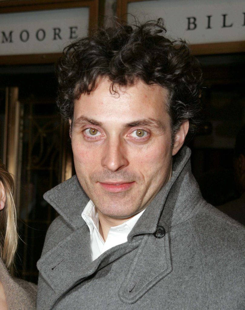 A Close-up Shot Of Actor Rufus Sewell With Piercing Dark Green Eyes. Background