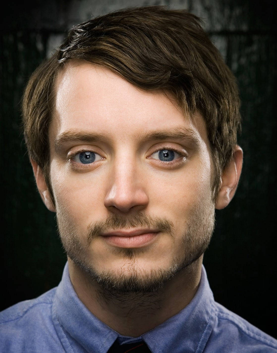 A Close-up Shot Of Elijah Wood Displaying An Innocent Expression Background