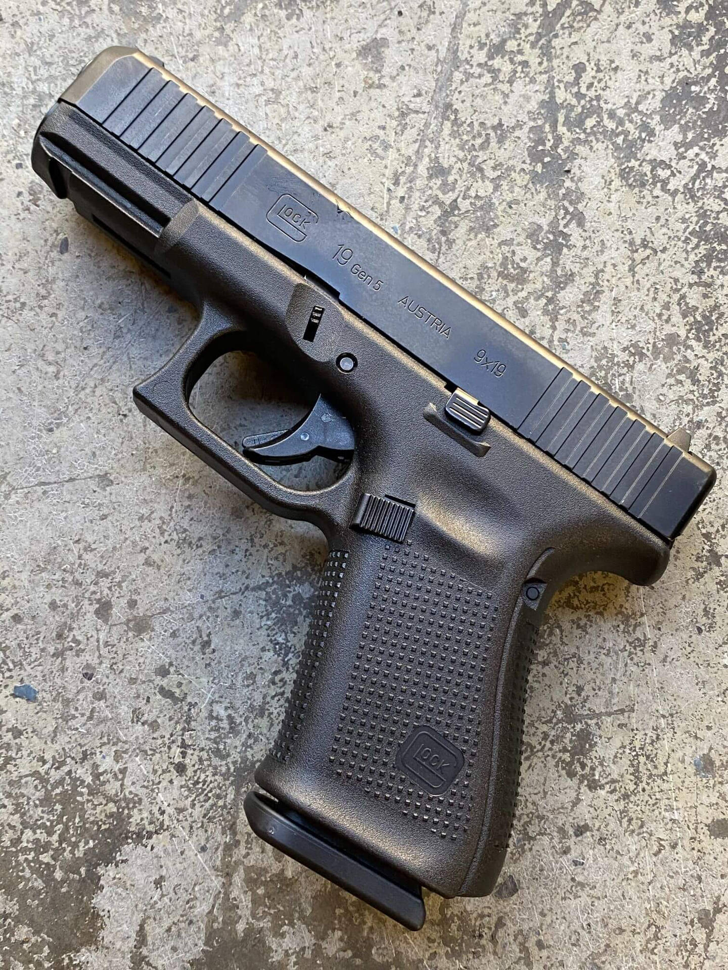 A Close-up View Of A Glock 19 Gen 5 Pistol Background