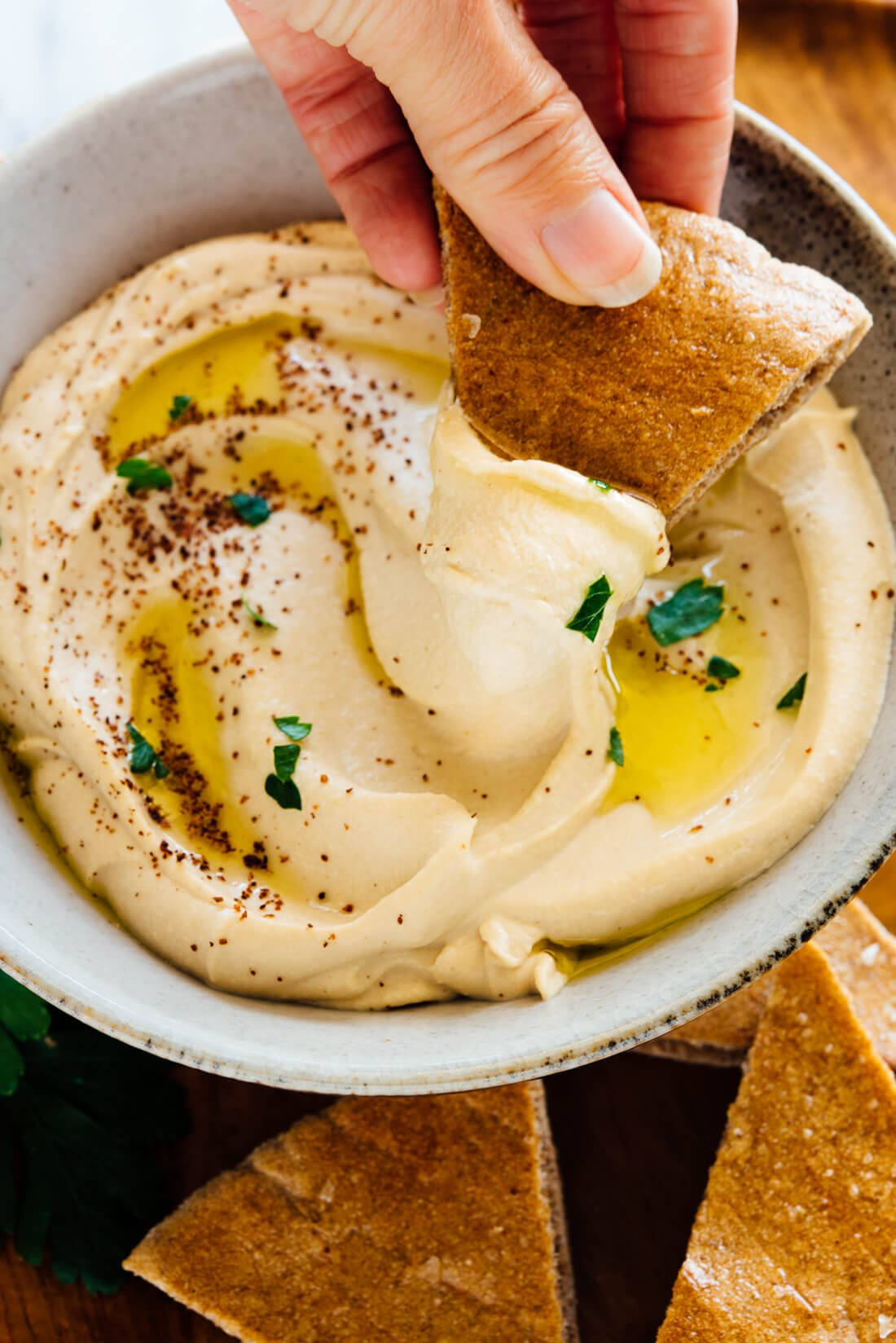 A Close-up View Of Hummus Dip With Pita Bread Background