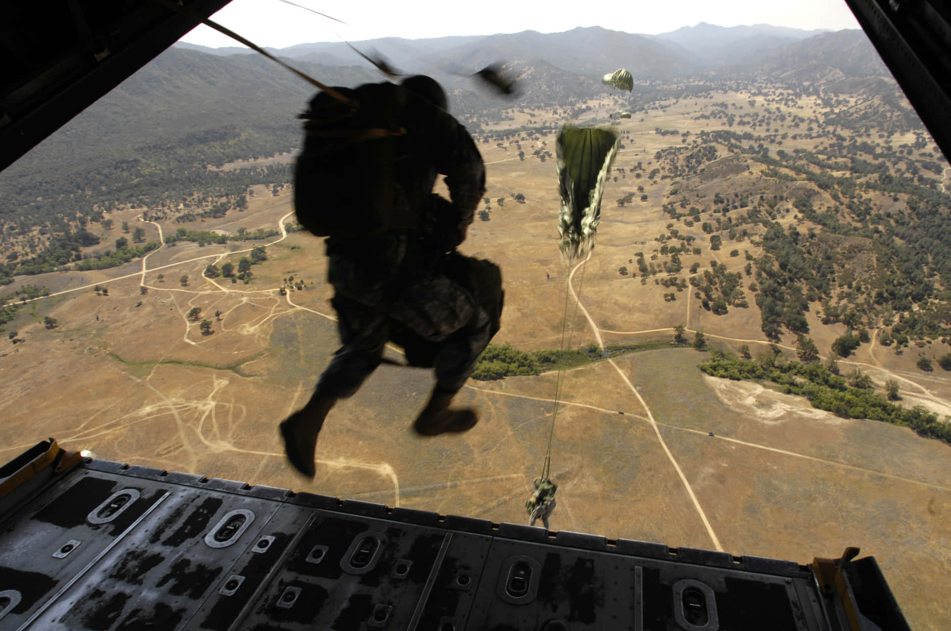 A Closeup Of Military Personnel In Formation. Background