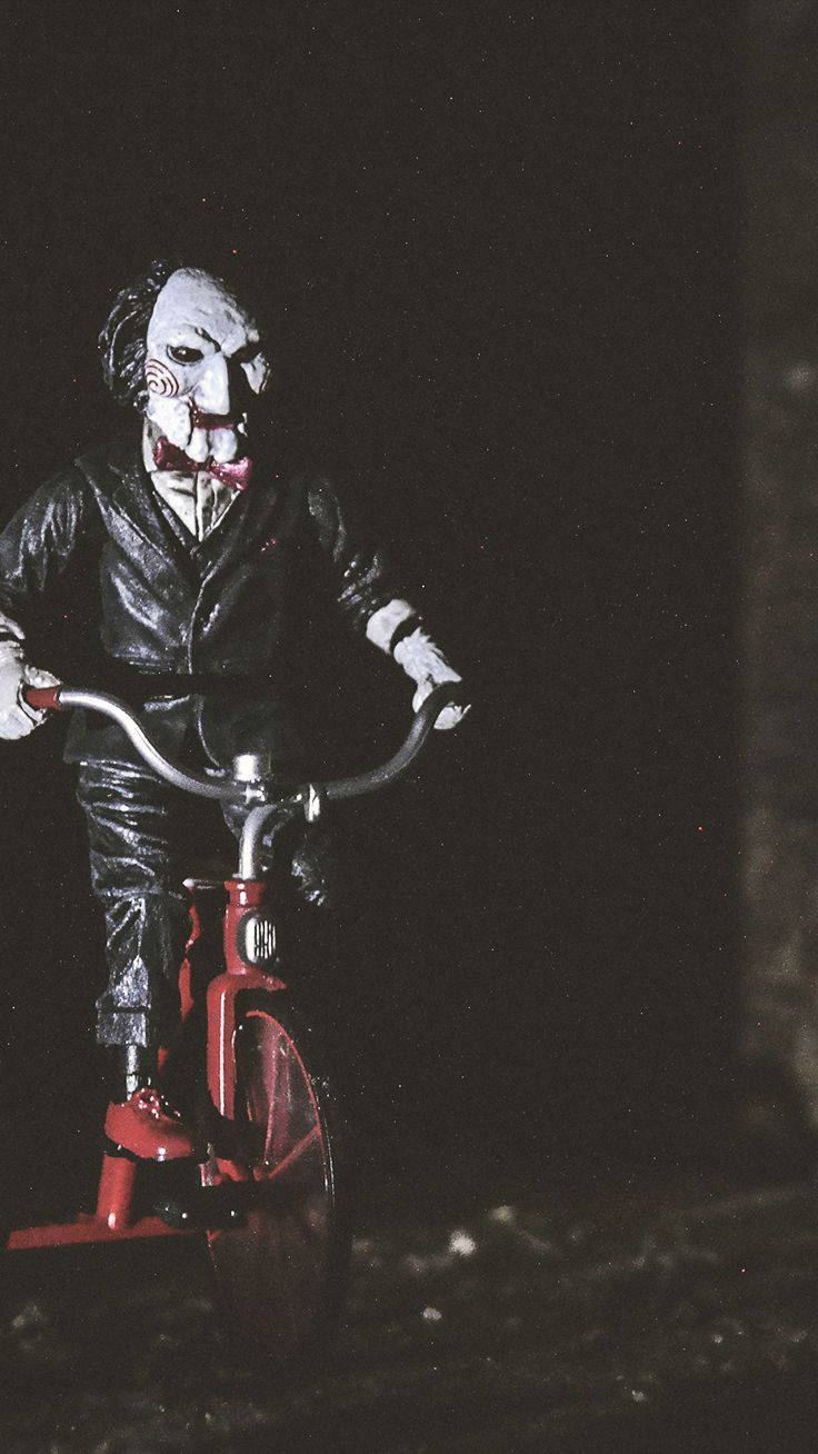 A Clown Riding A Bike Background