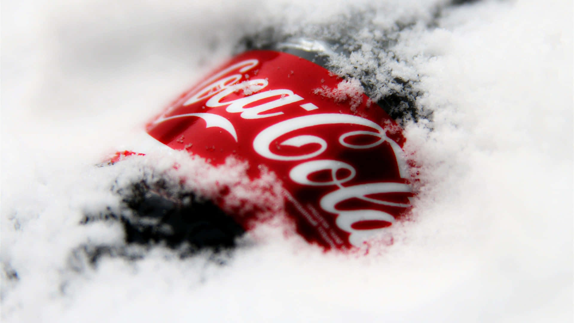 A Coca Cola Bottle Covered In Snow Background