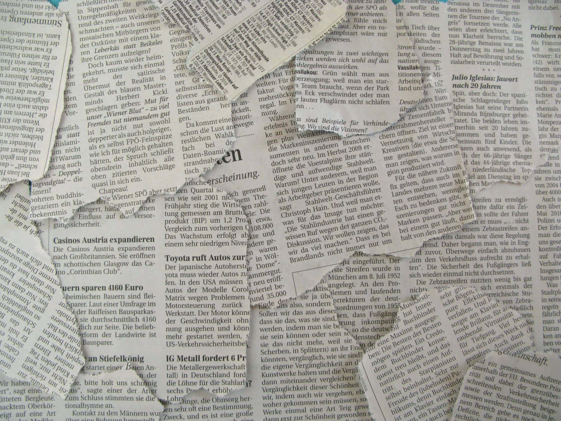 A Collage Of Newspaper Pieces With A Blue Background Background