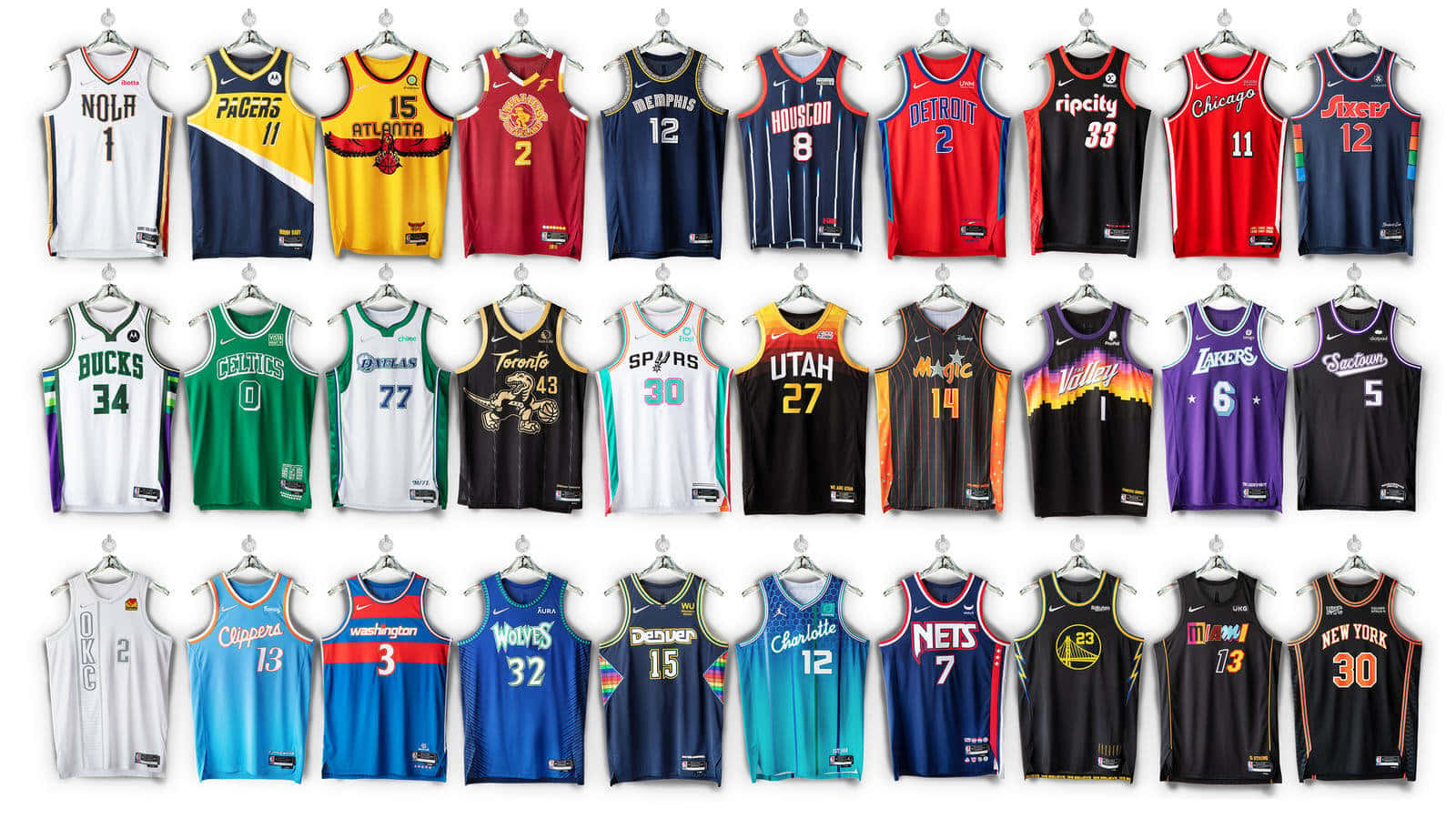 A Collection Of Basketball Jerseys Hanging On A Wall