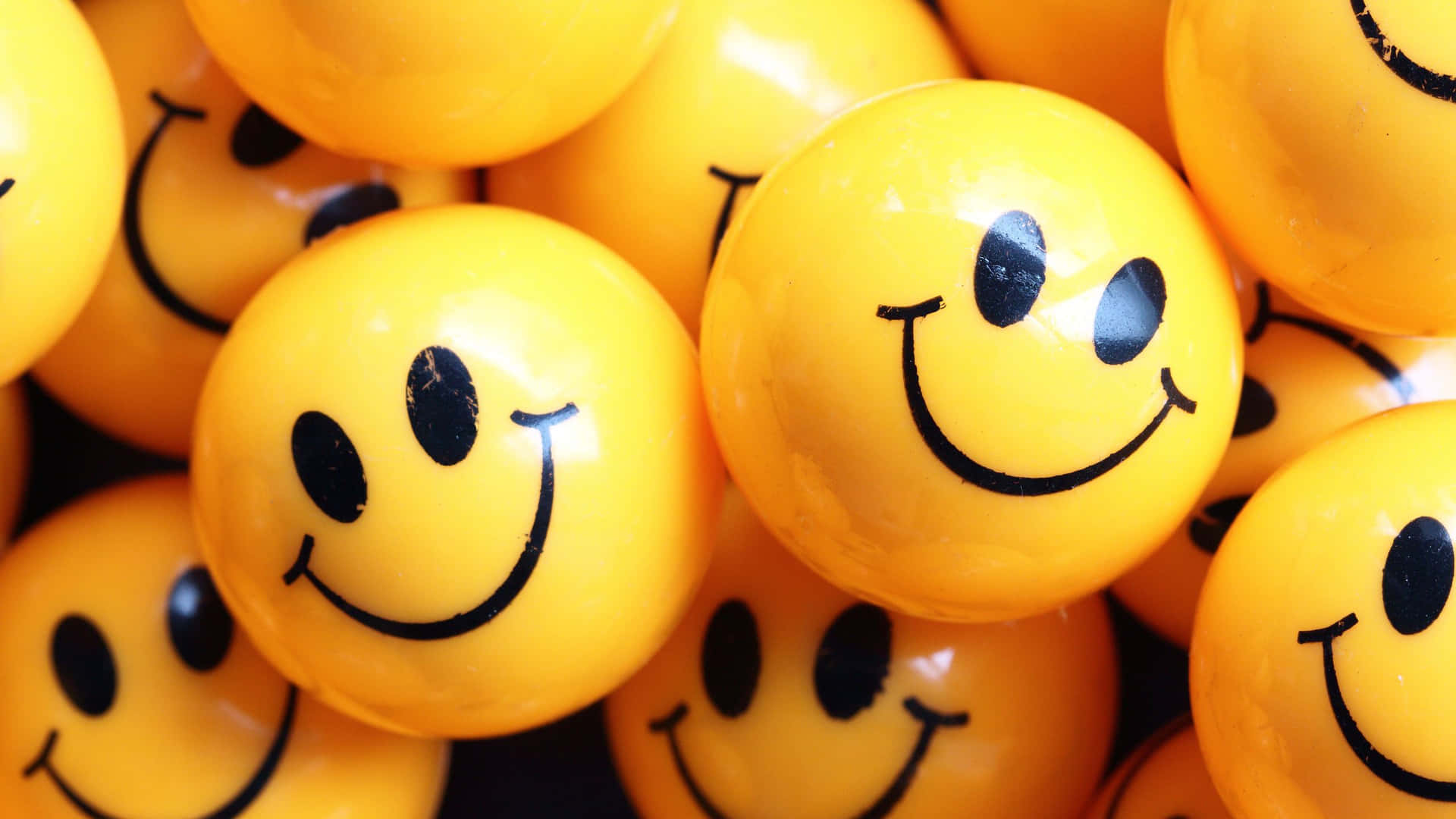 A Collection Of Cute Smile Emoji Balls Expressing Different Emotions.