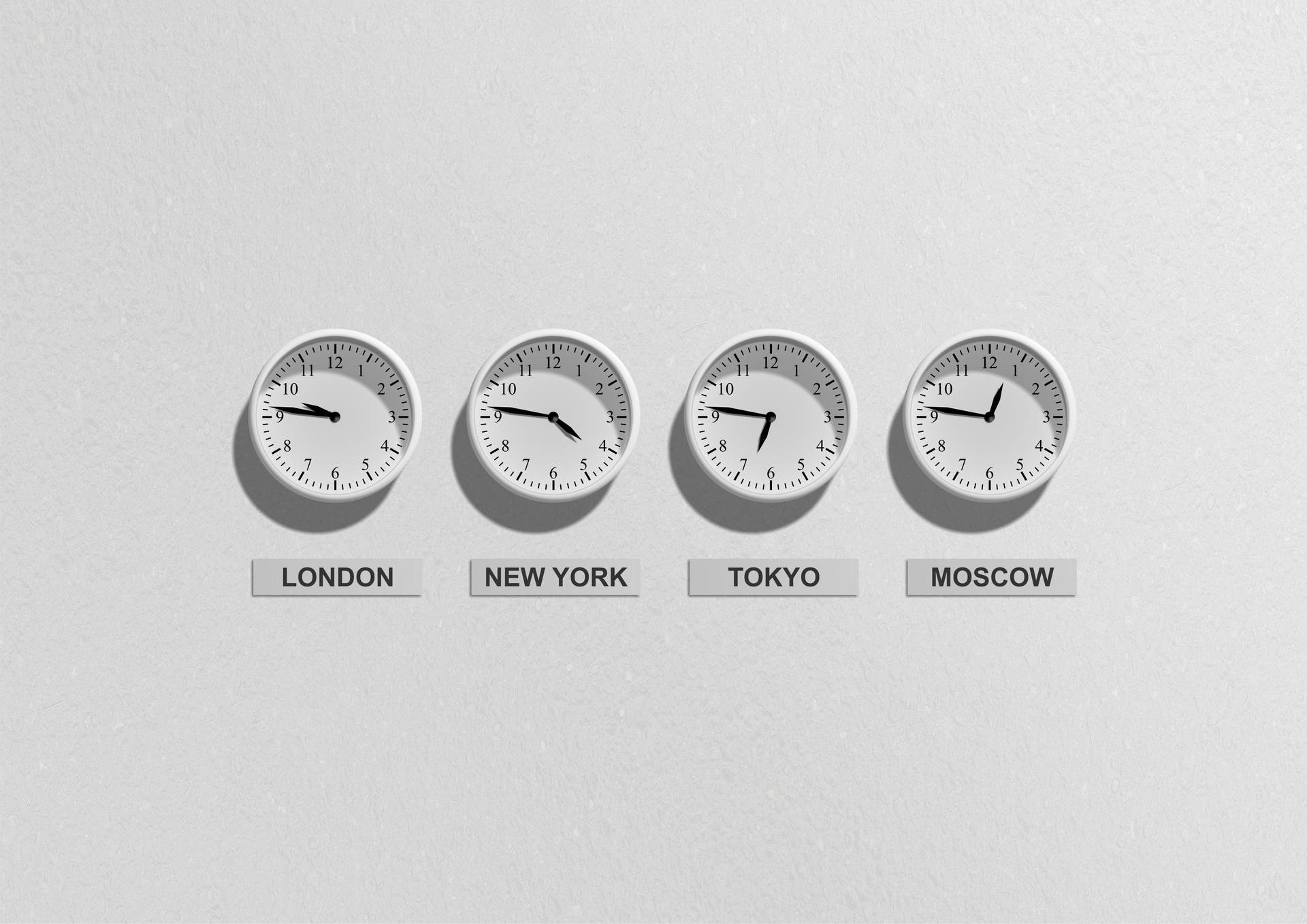 A Collection Of Wall Clocks On A White Background