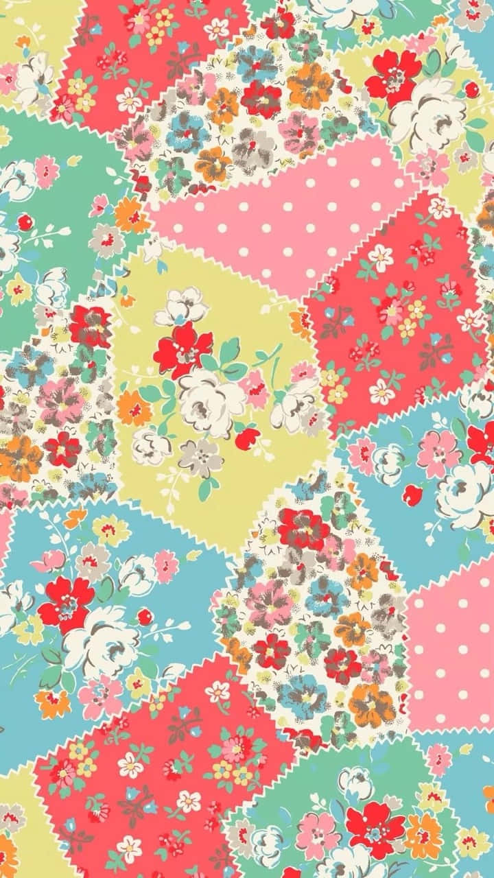 A Colorful Patchwork Fabric With Flowers And Polka Dots Background