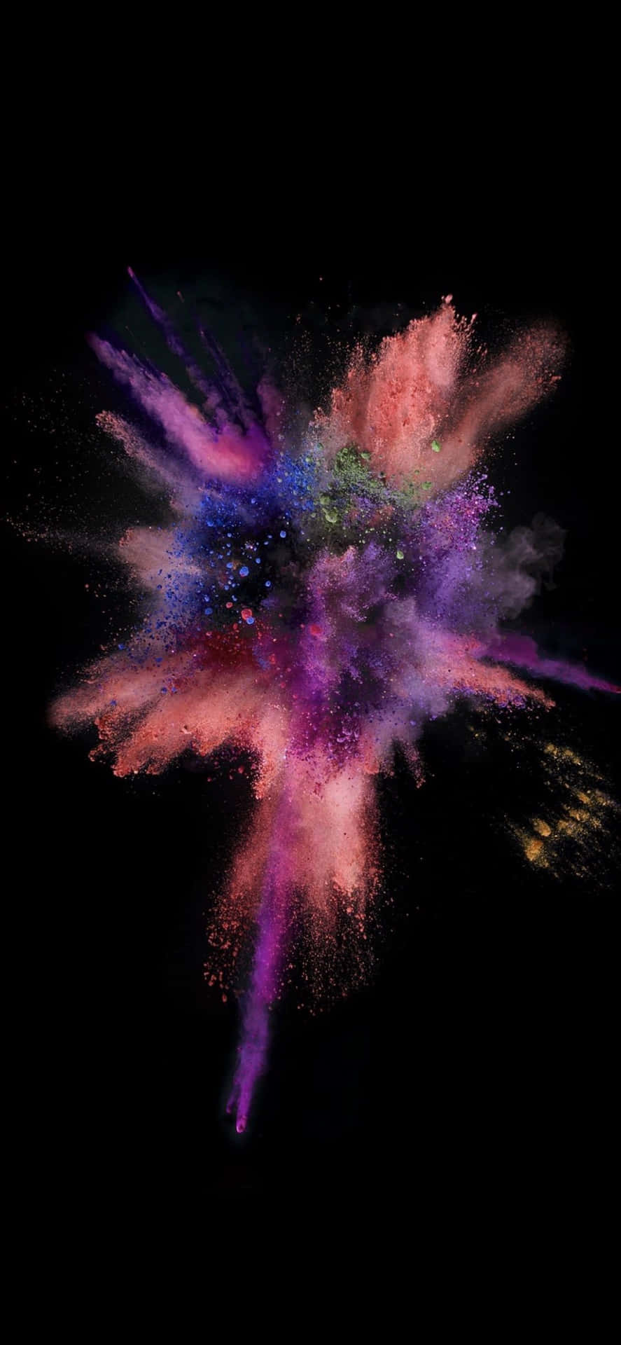 A Colorful Powder Explosion On A Black Background