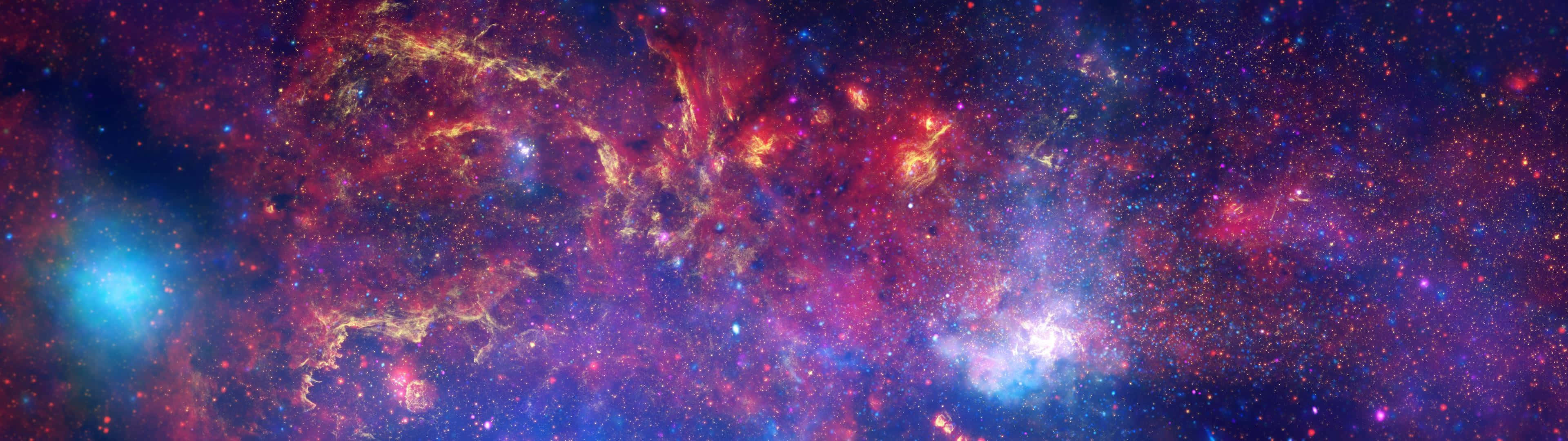 A Colorful Space With Stars And Nebulas