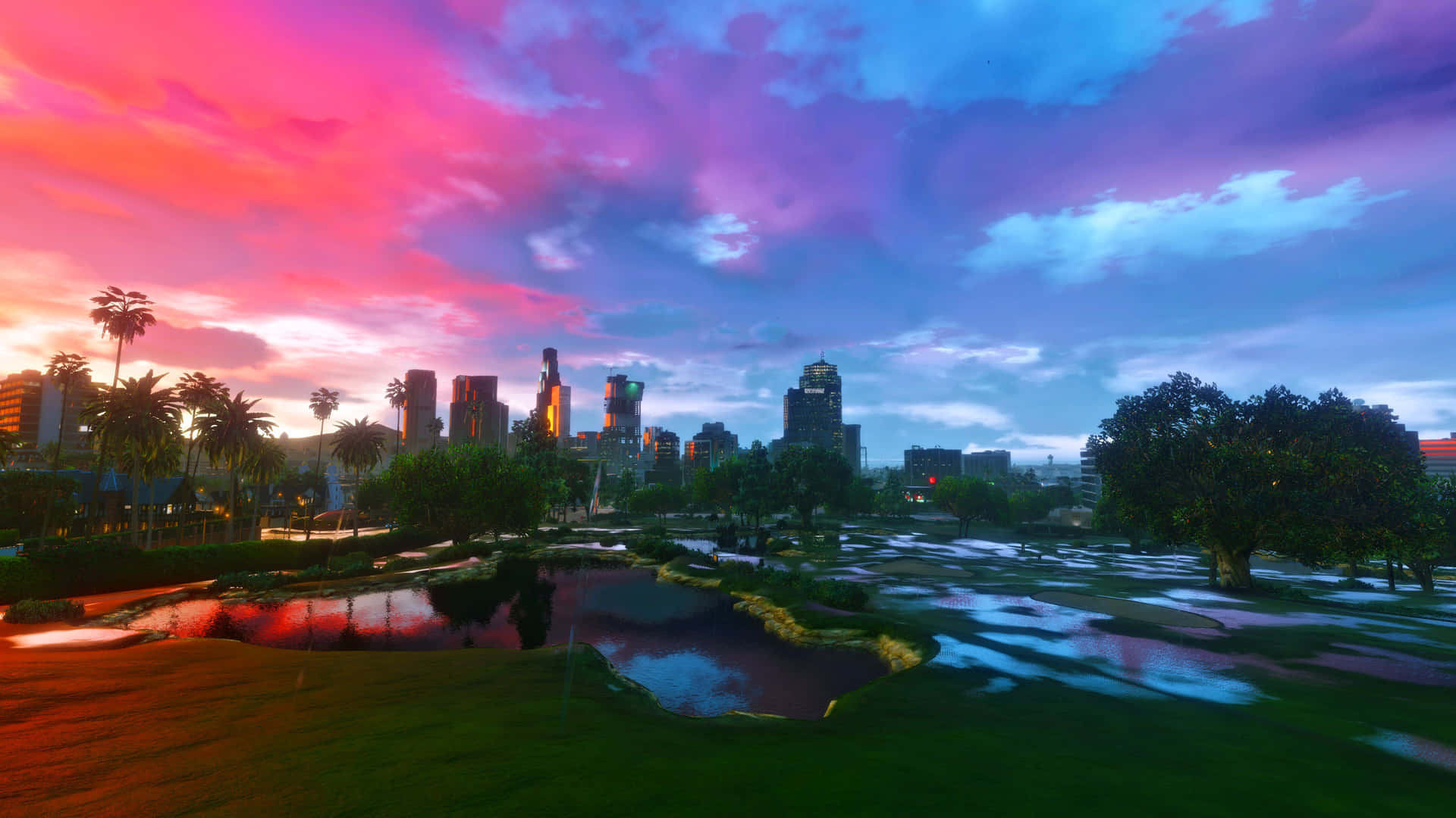 A Colorful Sunset Over A City With A Pond Background