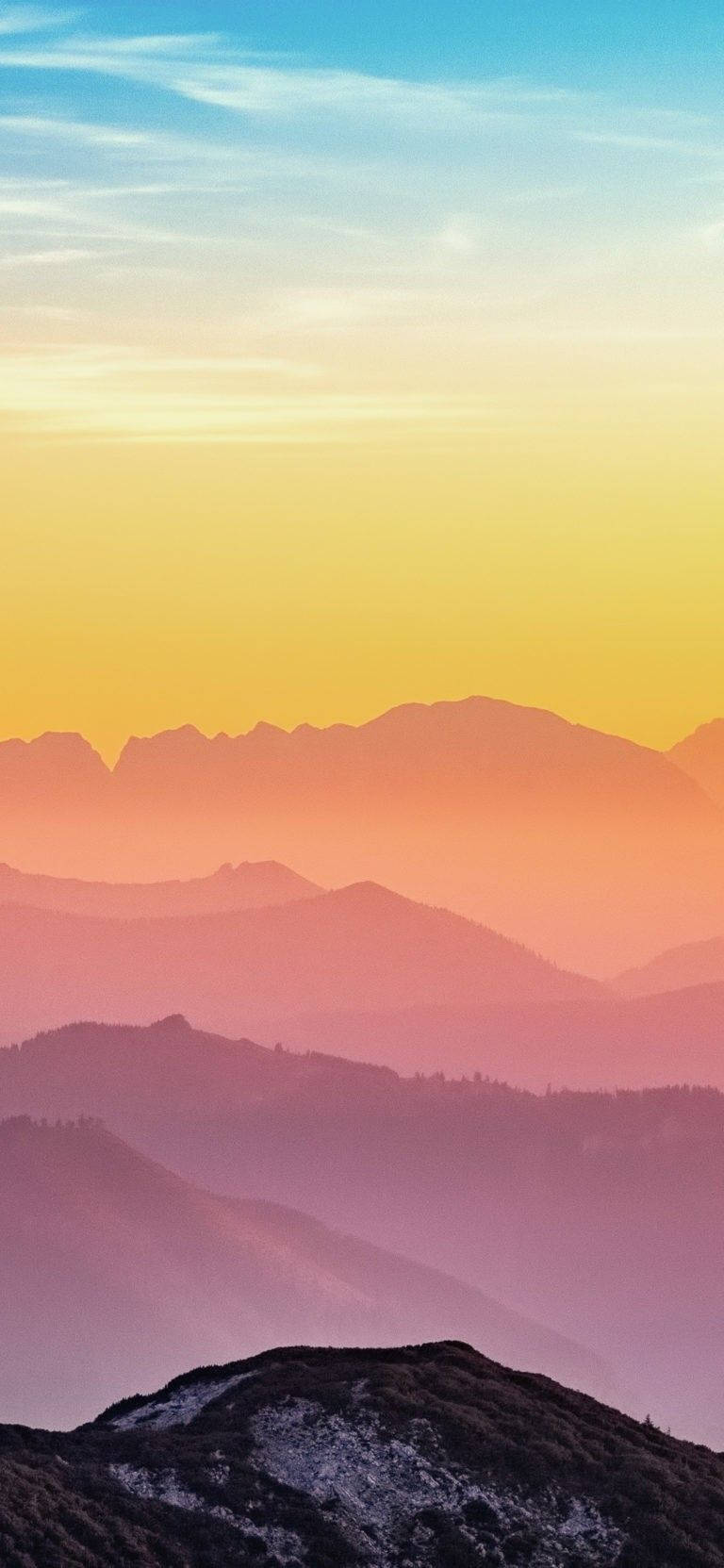 A Colorful Sunset Over The Mountains