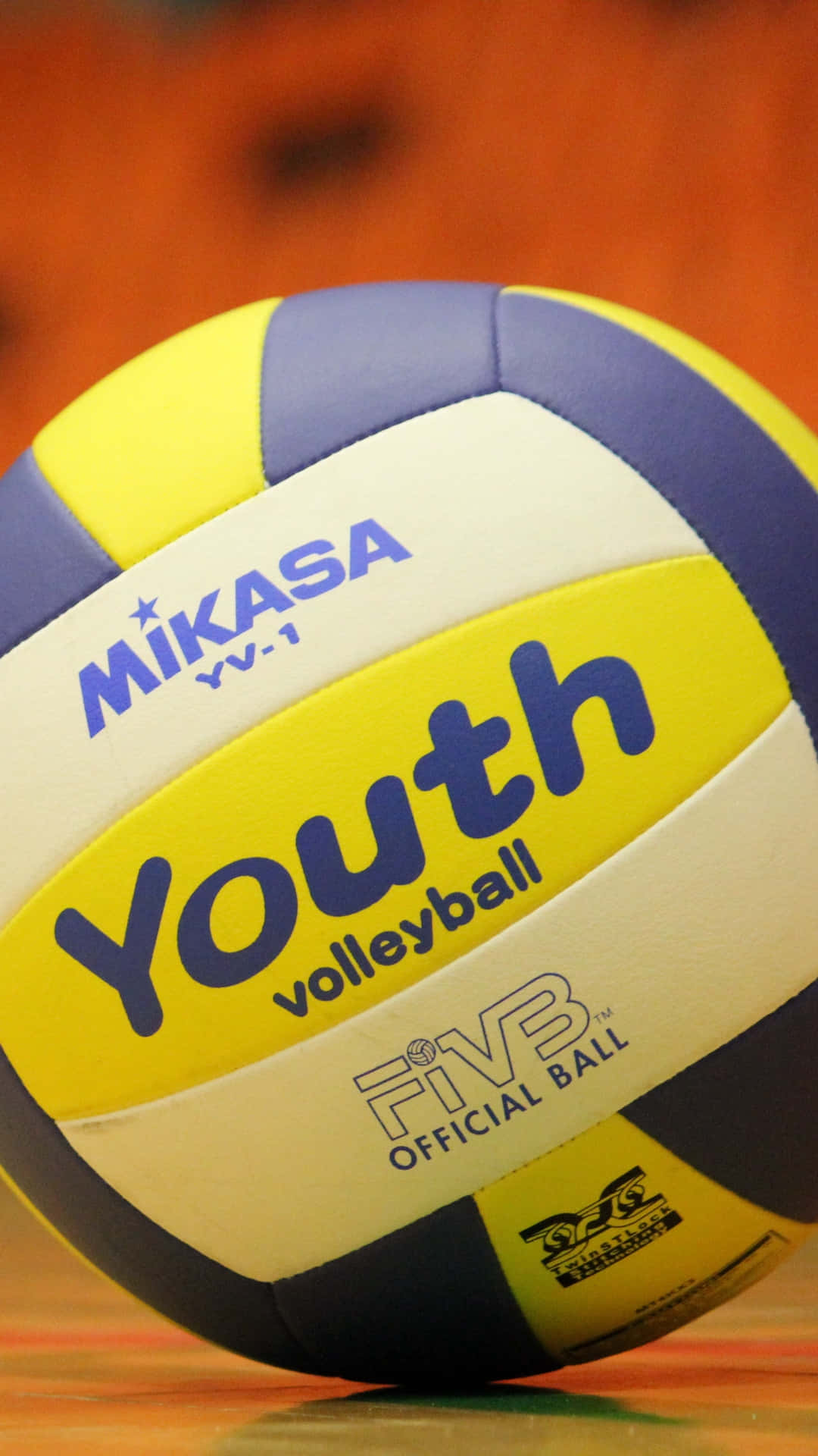 A Colorful Volleyball Ball In Mid-air Background