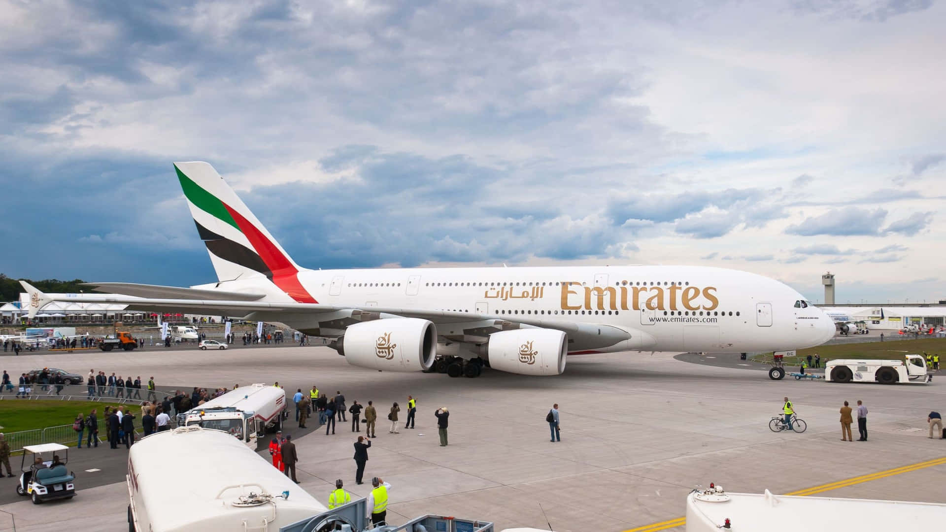 A Commercial Passenger Aircraft Flying Through The Sky Background