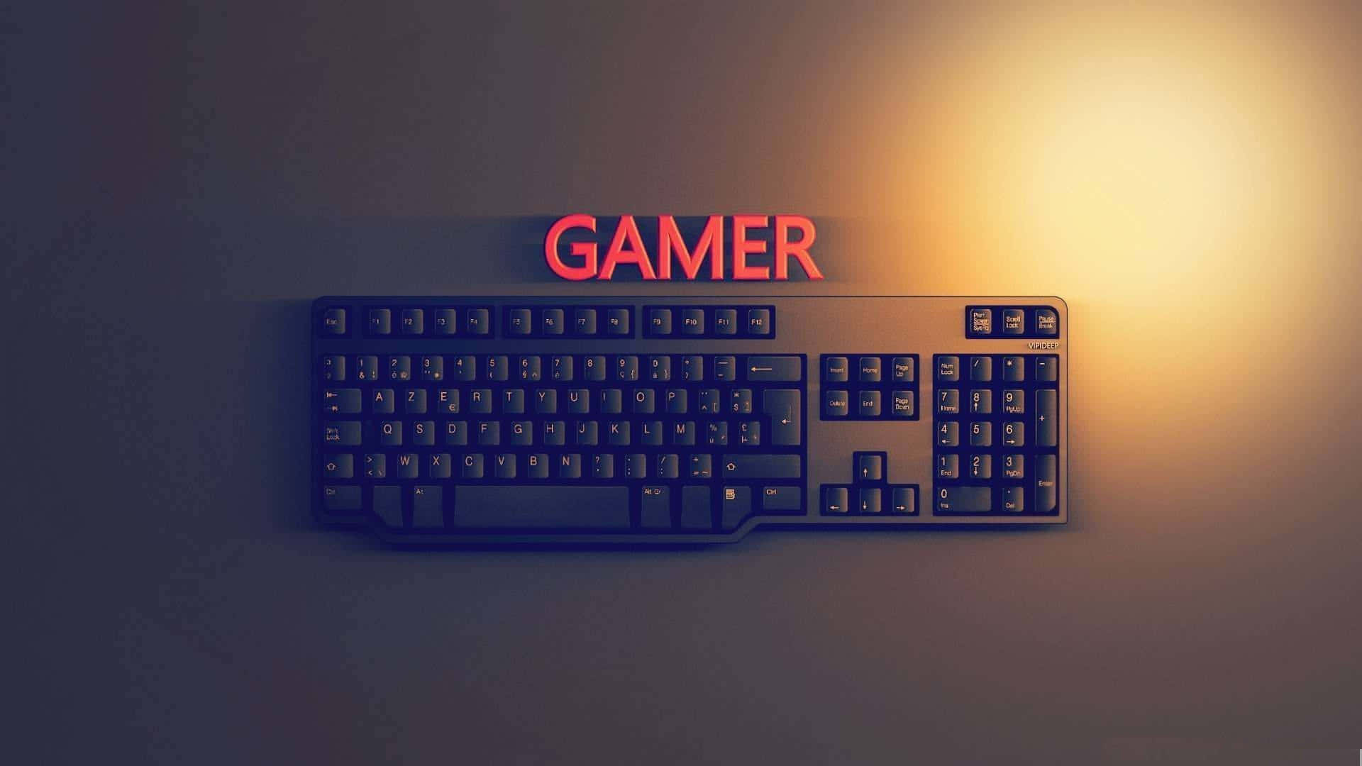 A Computer Keyboard With The Word Gamer On It Background