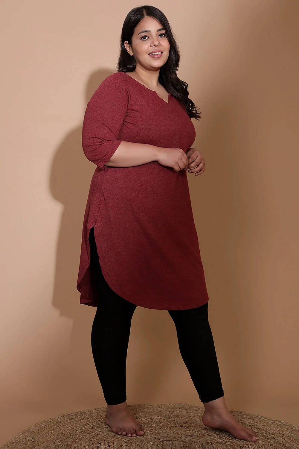 A Confident Plus-size Individual In Bright Red Apparel