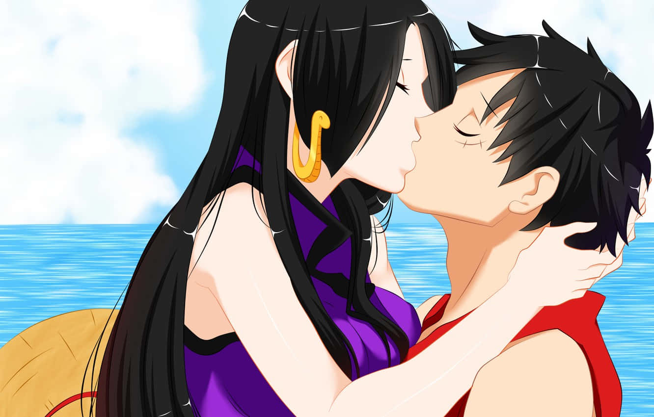 A Couple Kissing In Front Of The Ocean Background