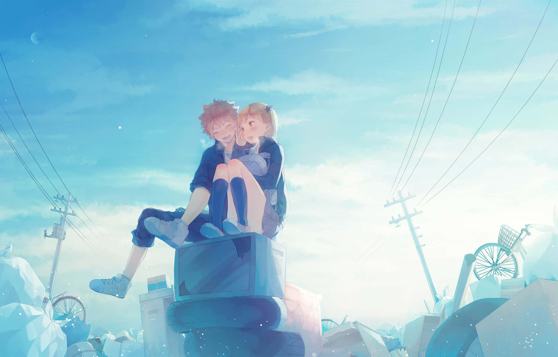A Couple Sitting On Top Of Some Rocks Background