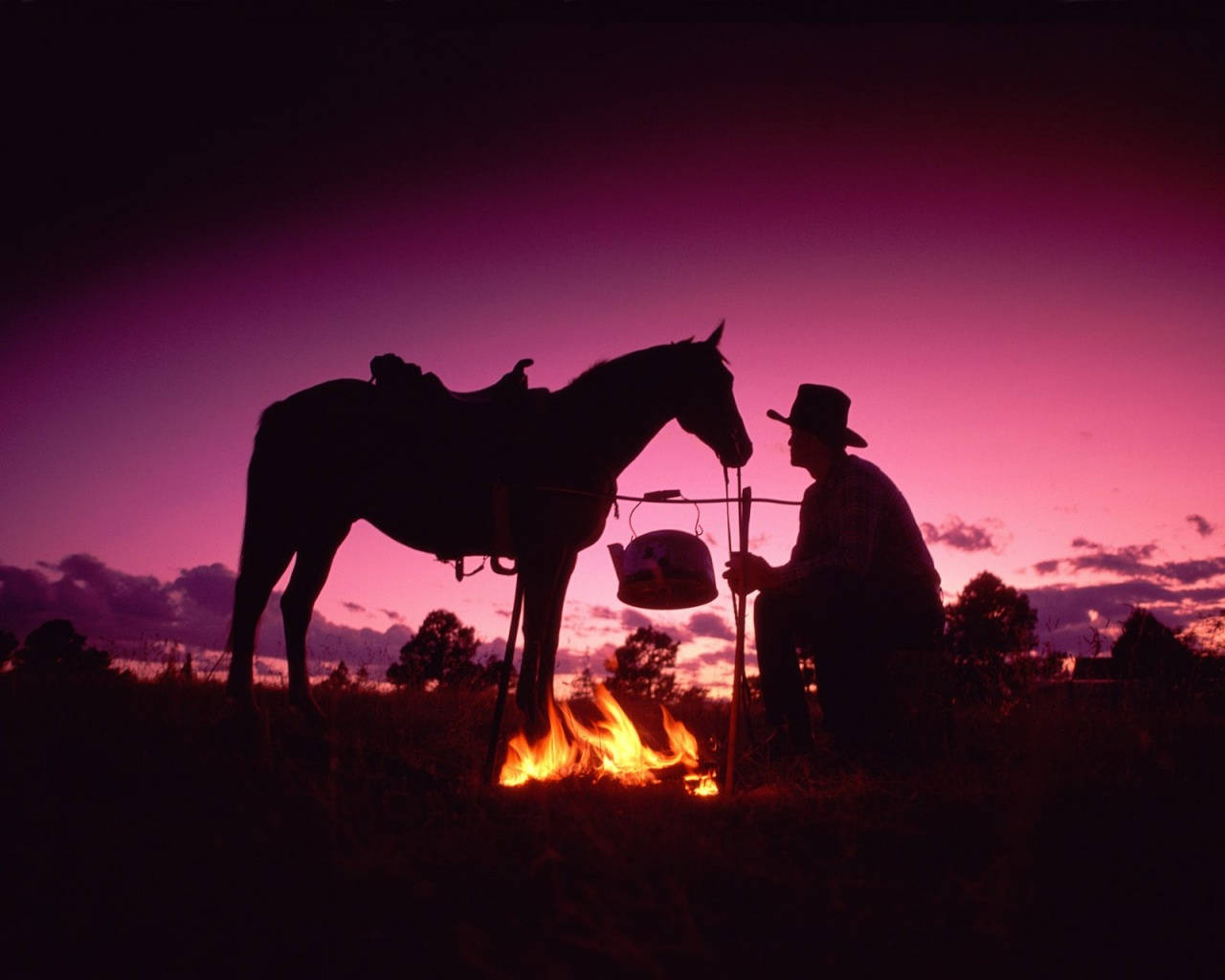 A Cowboy Enjoys Life On The Ranch Background