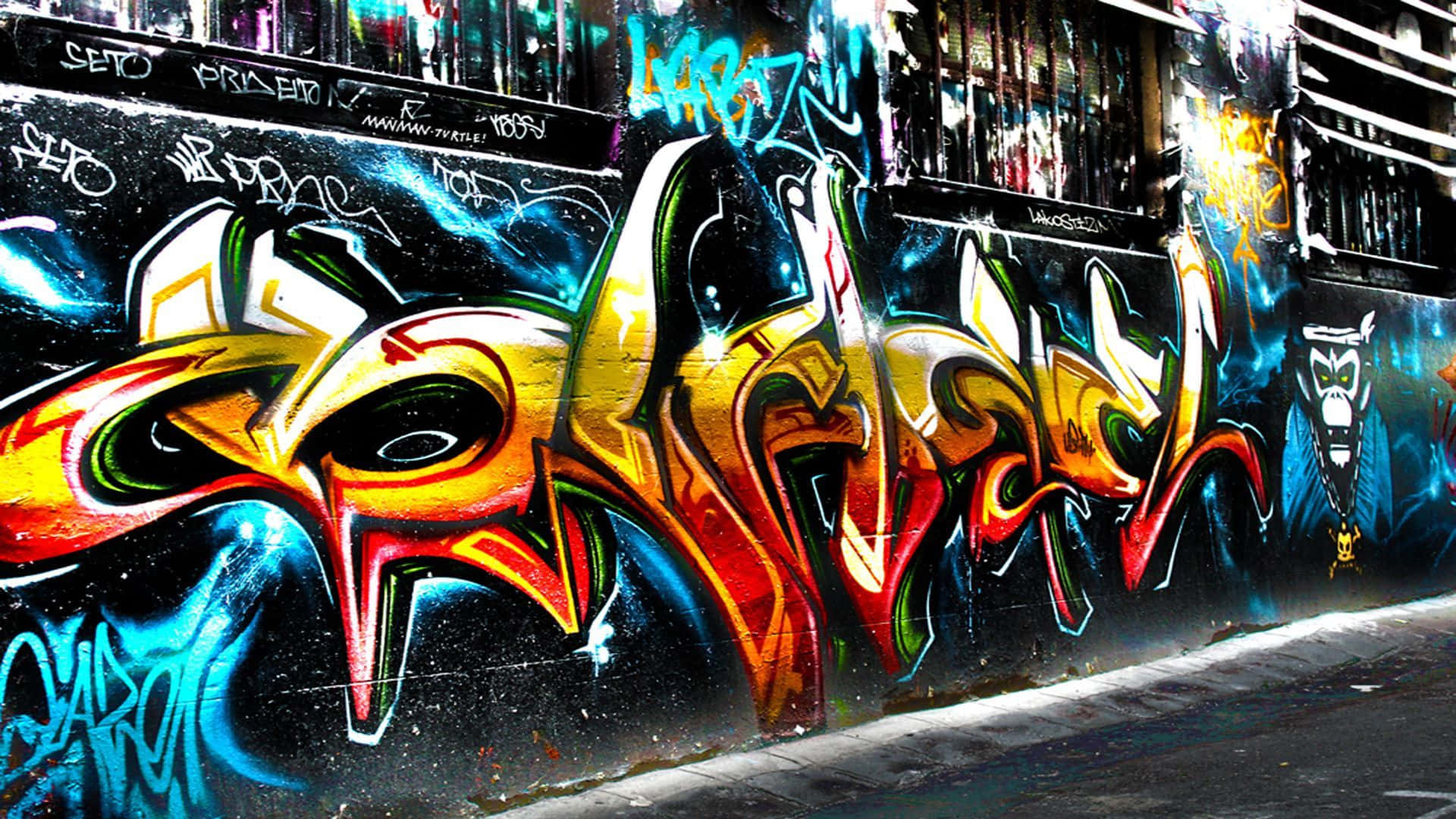 A Creative Street Art Wall With A Colourful Graffiti Background
