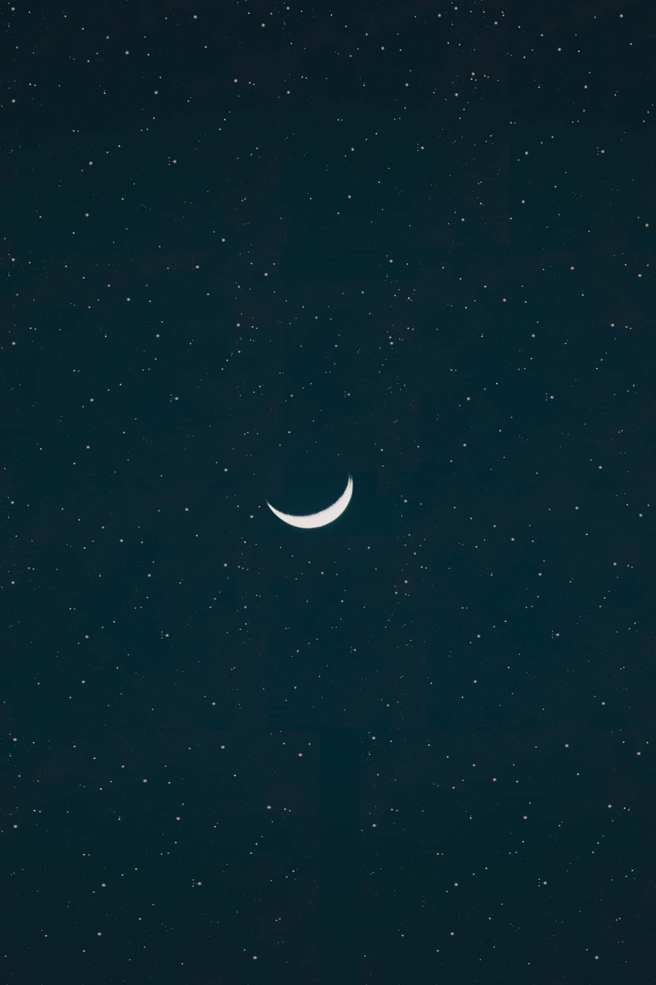 A Crescent In The Sky With Stars Background