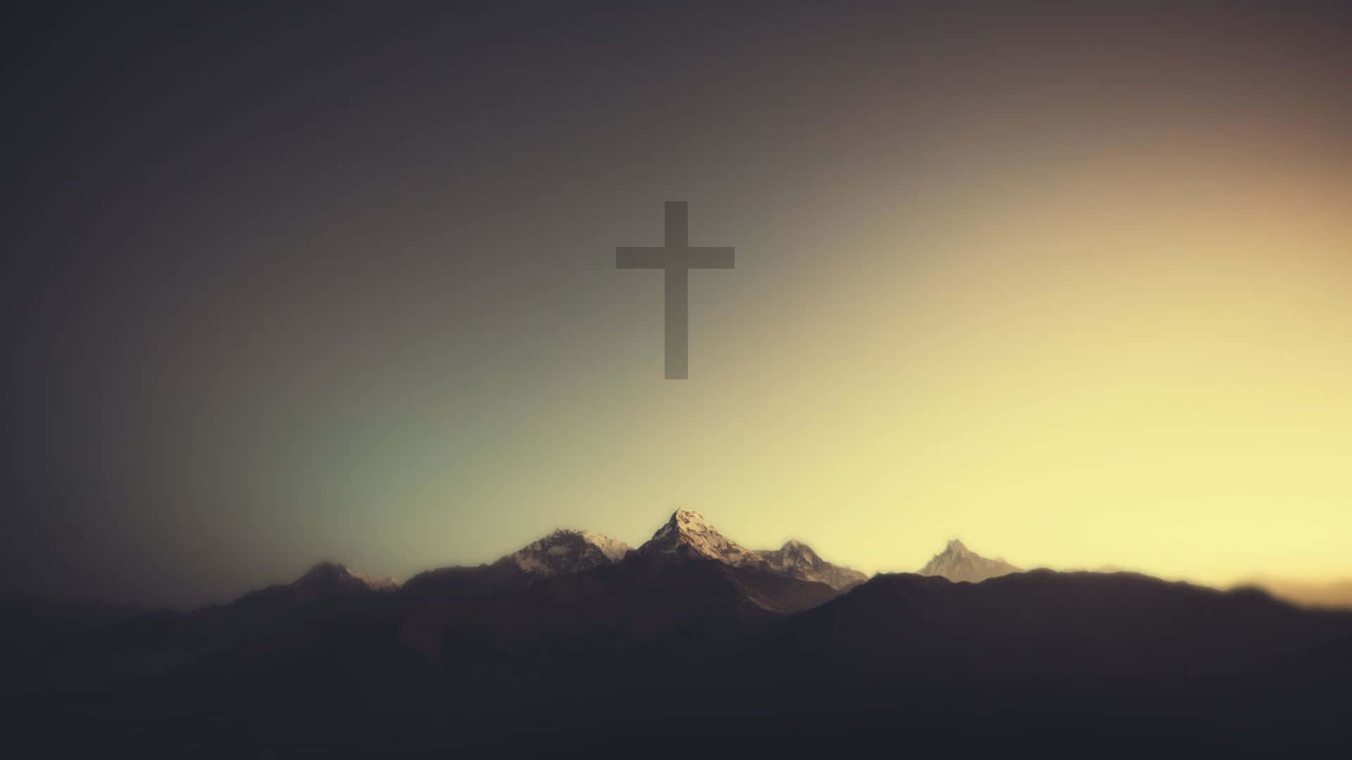 A Cross Is Shown On Top Of A Mountain Background