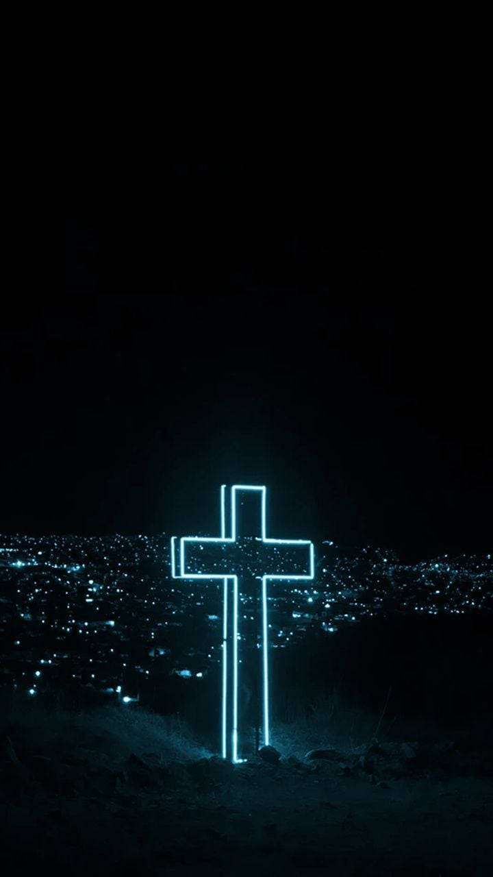 A Cross With Neon Lights In The Dark Background