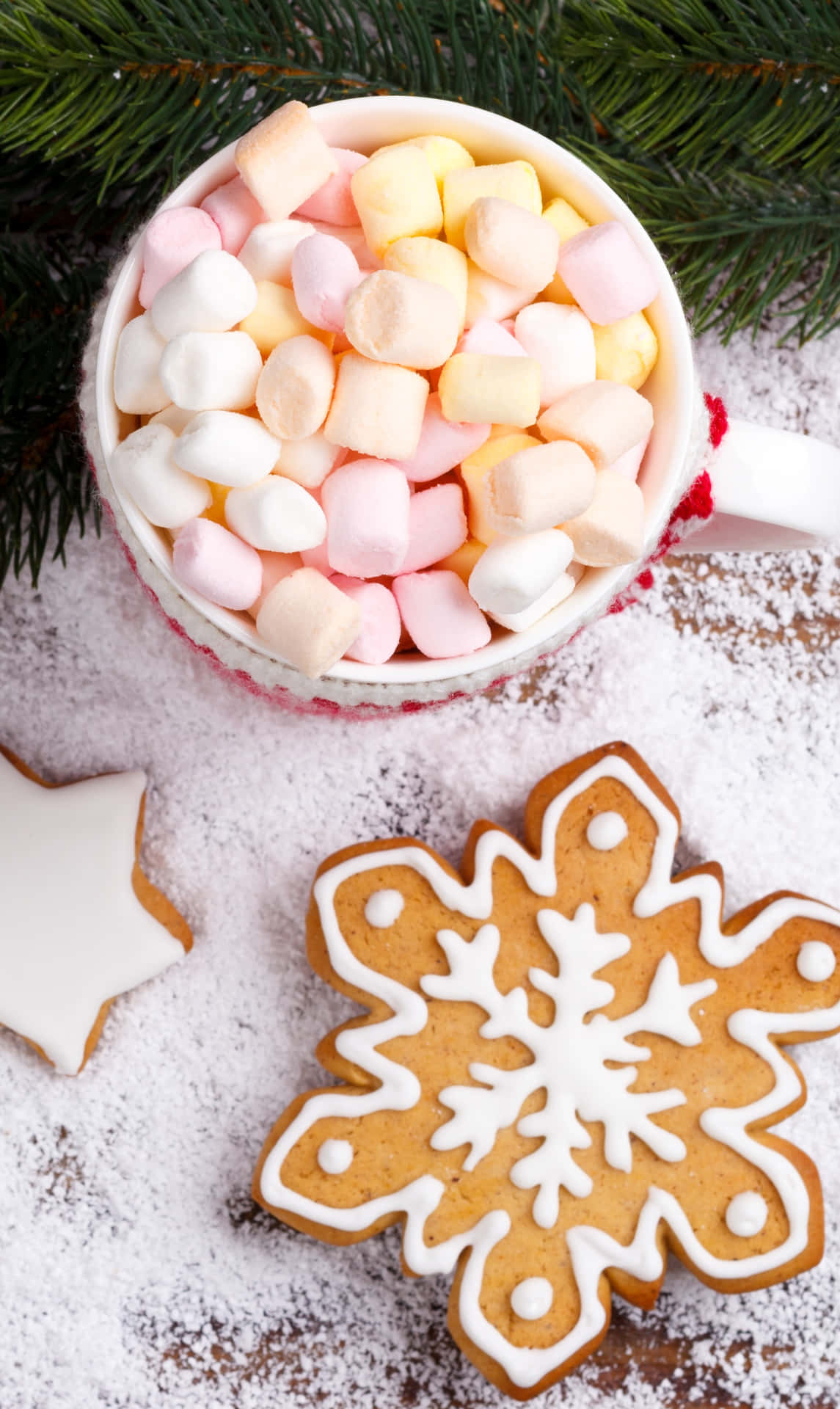 A Cup Of Hot Chocolate With Marshmallows And Snowflakes Background
