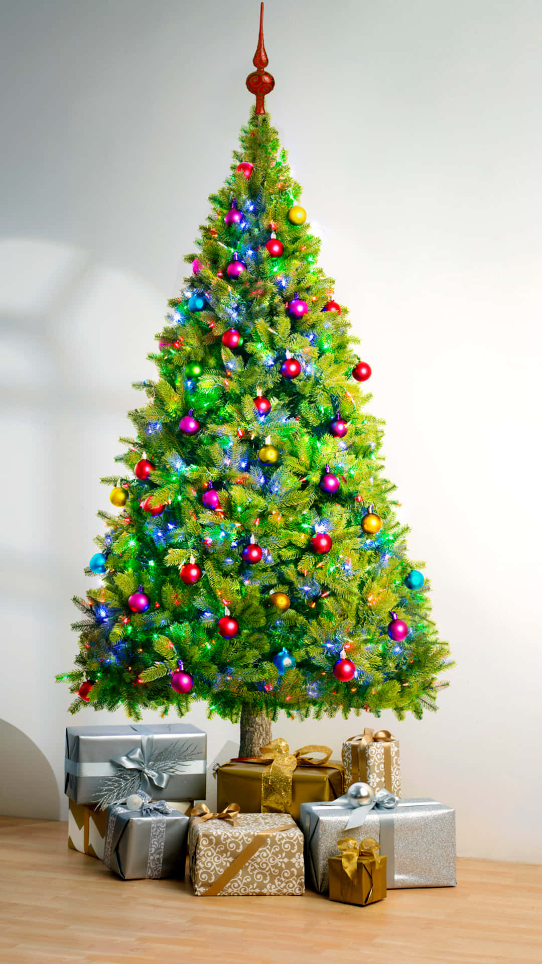 A Cute Christmas Tree Dressed Up With Colorful Decorations Background