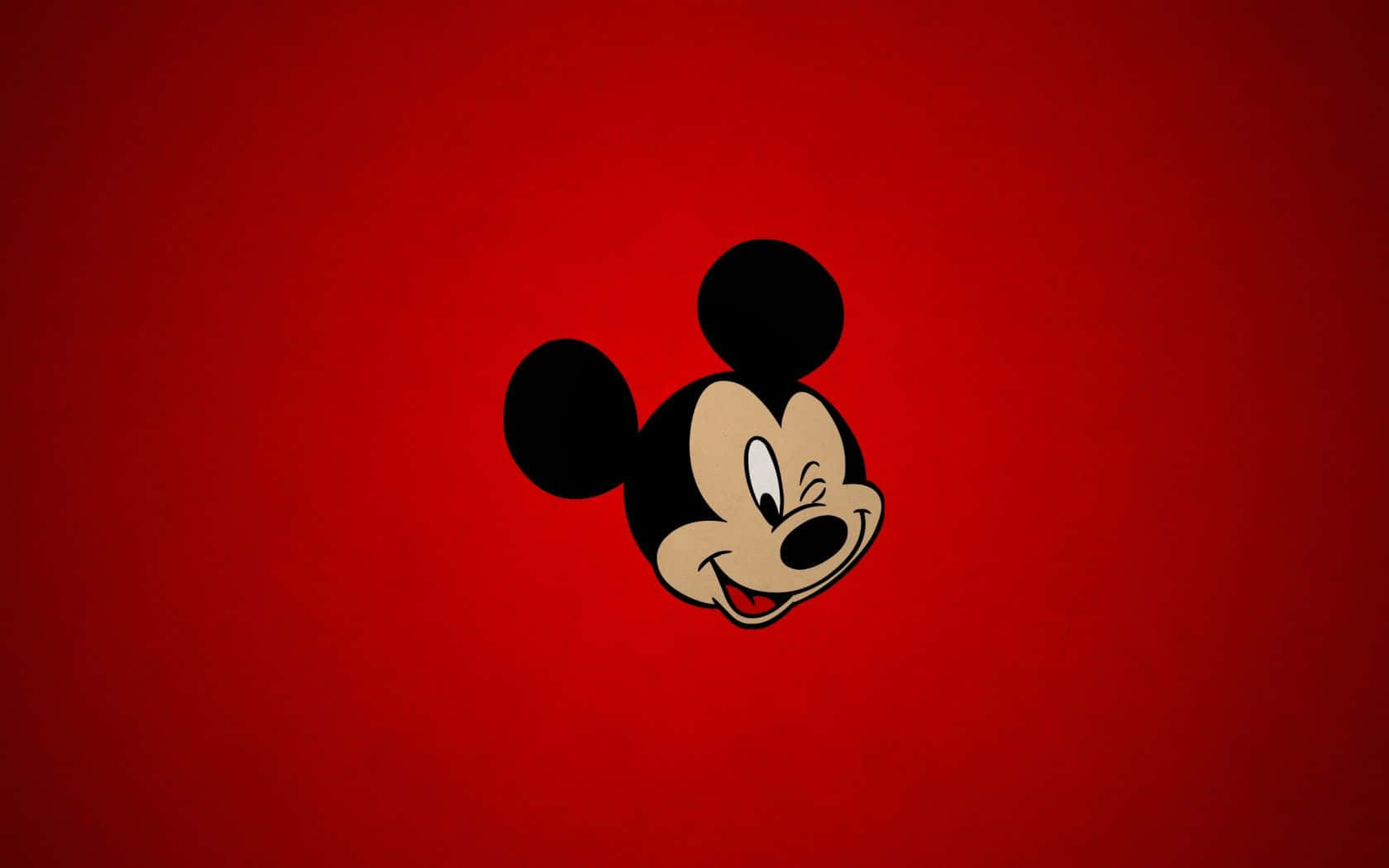 A Cute Mickey Mouse Cartoon Shows The Joyous Character Smiling Brightly.