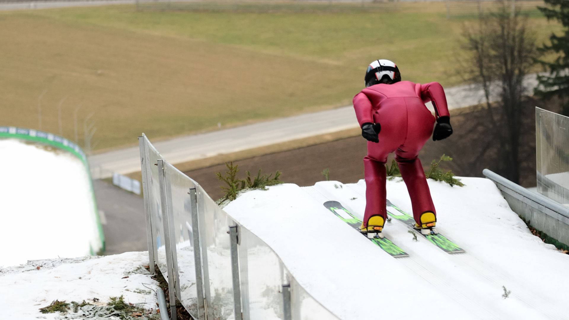 A Daring Leap - The Prowess Of Ski Jumping Background