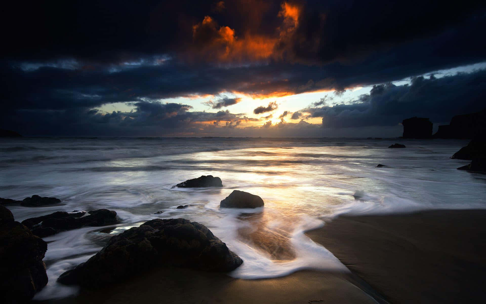 A Dark Sky And Waves At Sunset
