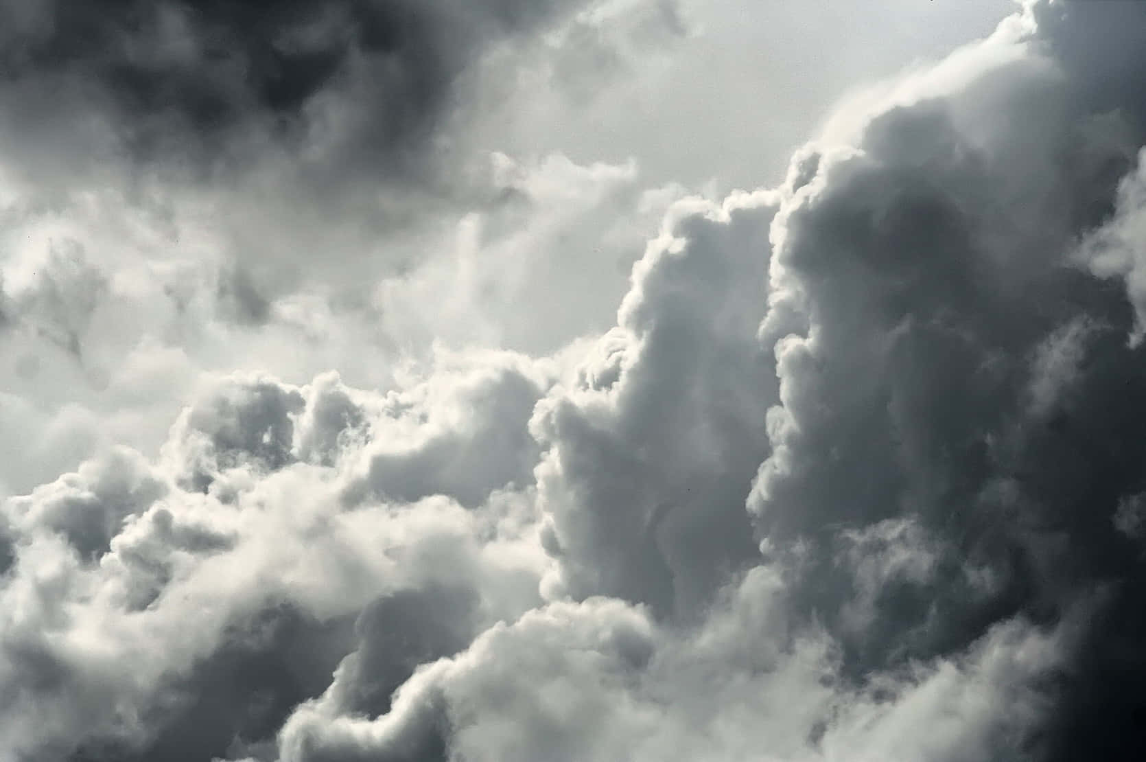 A Dark Sky With Many Clouds Background
