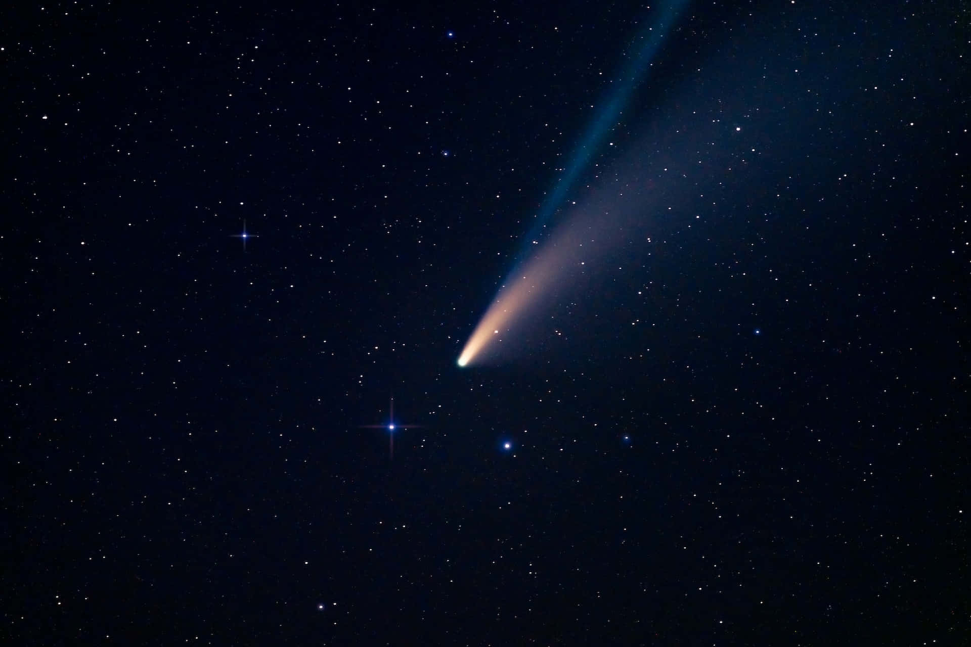 A Dazzling Comet Streaks Across The Night Sky