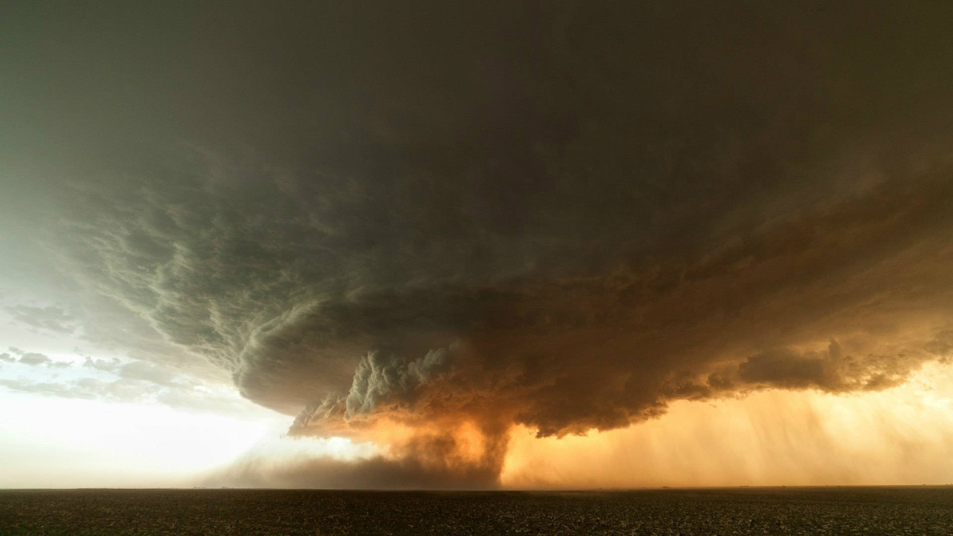 A Deadly Land-spouts Tornado Roaring Through The Vast Plains Background