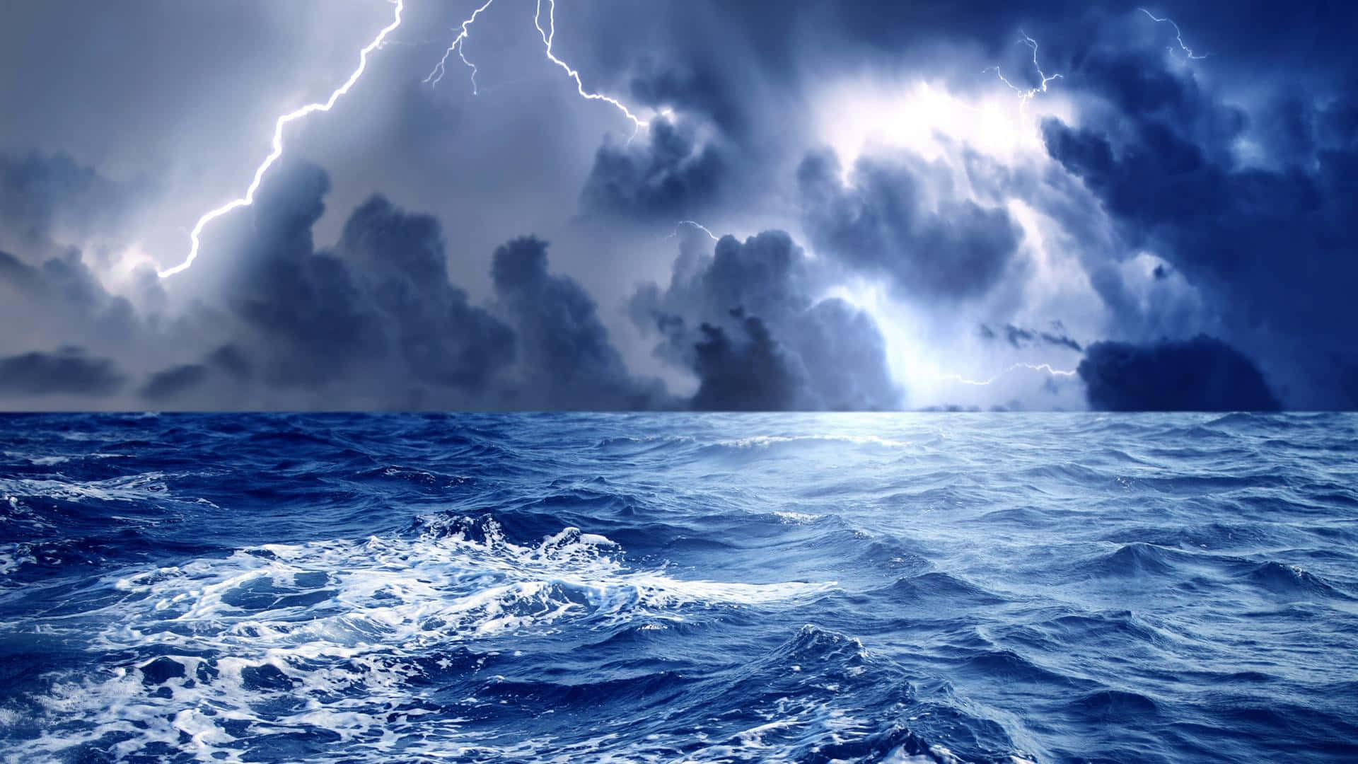 A Deadly Storm Crashing Against The Ocean Waves Background