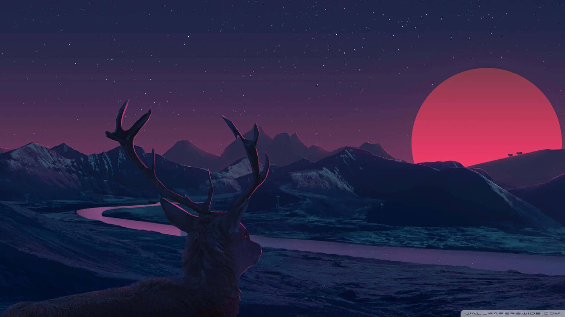 A Deer Is Standing In The Mountains With A Red Sunset Background