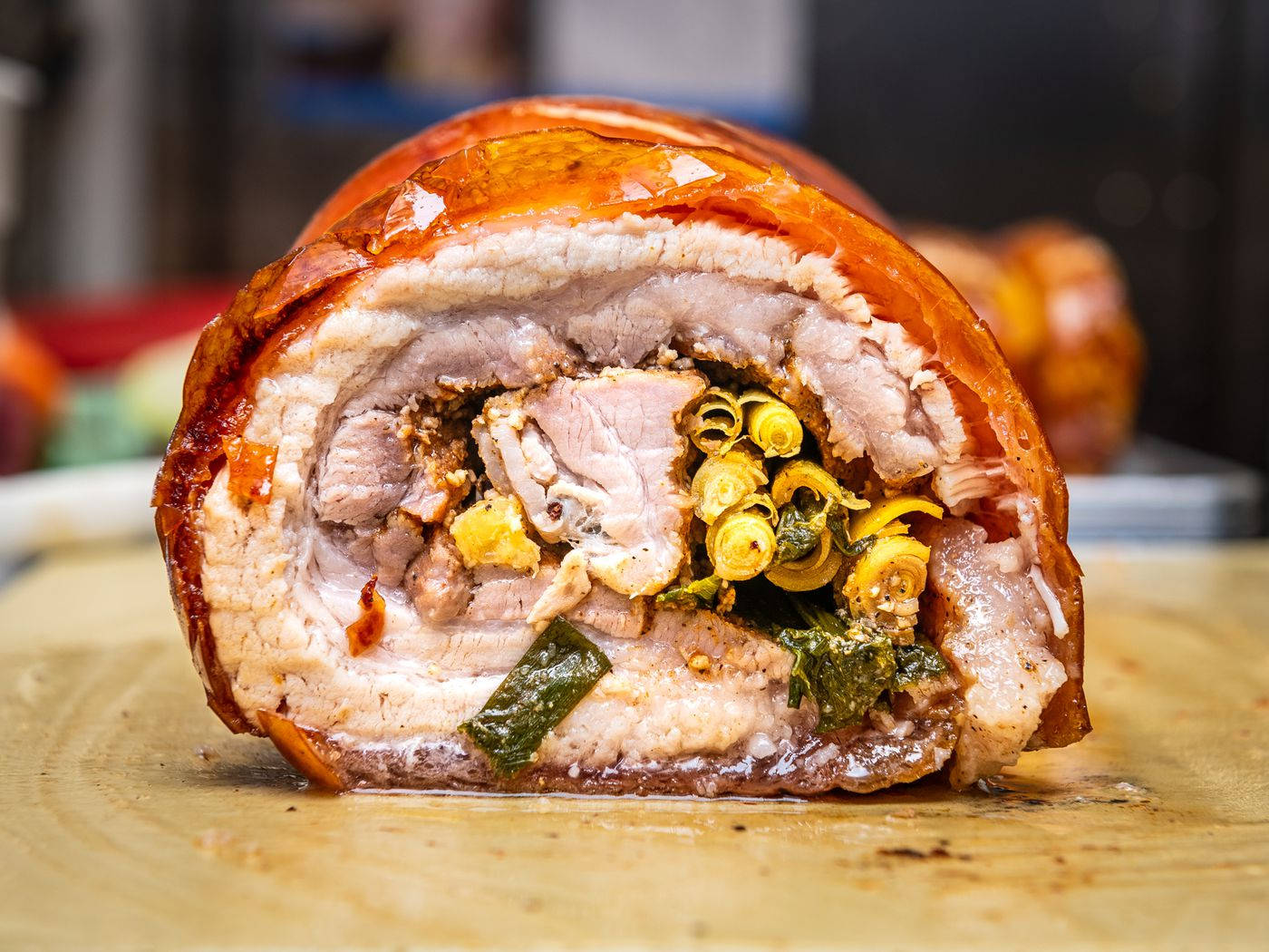 A Delectable Feast - Inside View Of Sumptuous Lechon Belly Roll Background