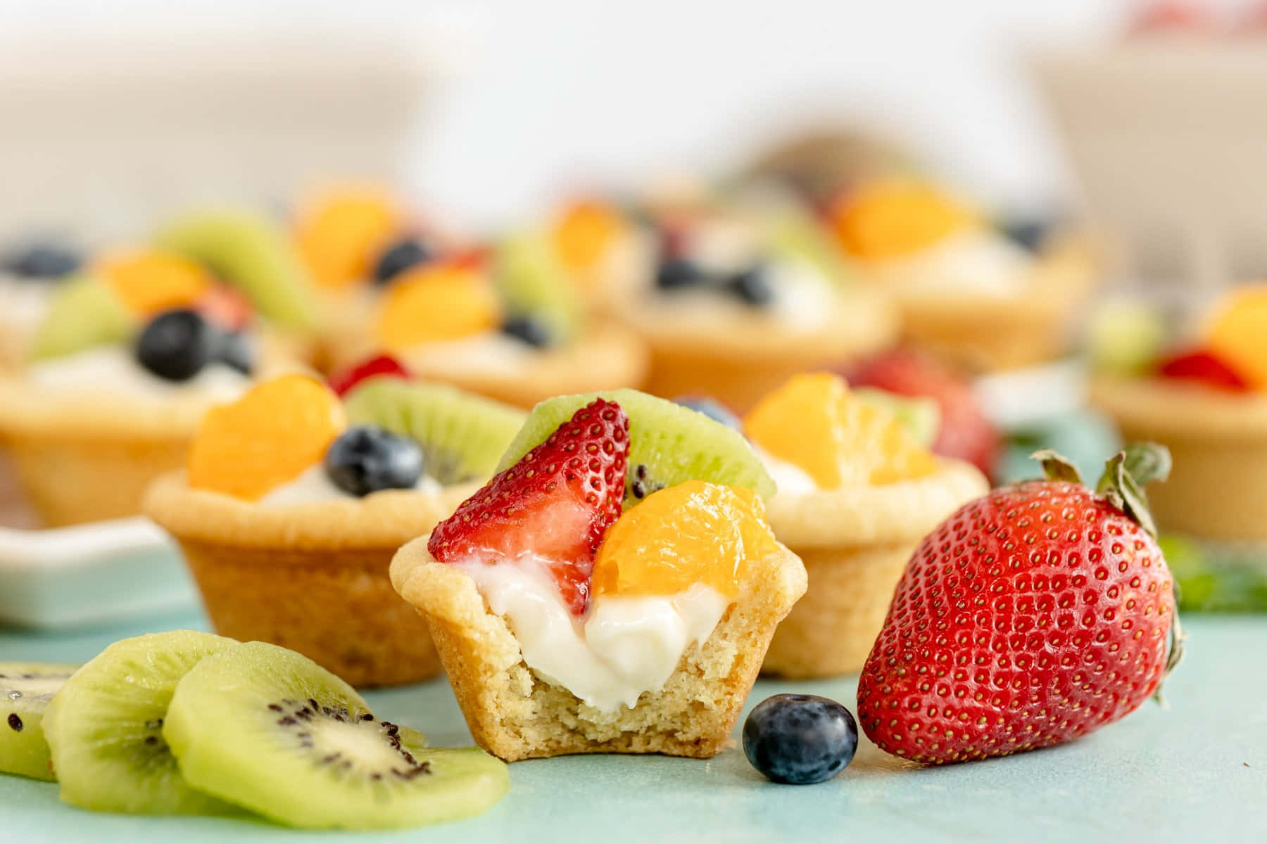 A Delectable Fruit Tarte On A White Plate Background